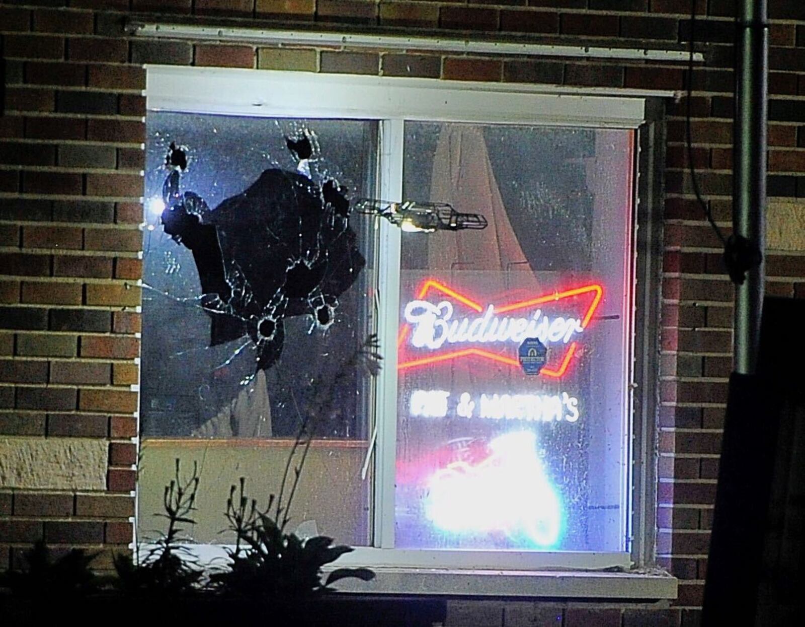 A drone flies near a broken window during a standoff with a man who went into Pat & Martha’s Tavern on Thursday night, Aug. 27, 2020. The man had a gun and threatened the owner, but the standoff ended after more than five hours when the man was found dead with an apparent self-inflicted gunshot wound. MARSHALL GORBY/STAFF