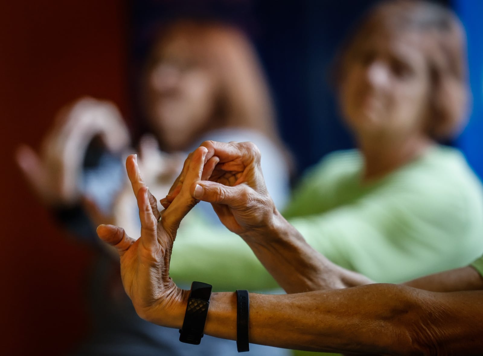 Lohrey Recreation Center yoga teacher, Karla Brun teaches a class of seniors. Older adults can stay active during the cold weather by visiting their local recreation center. JIM NOELKER/STAFF