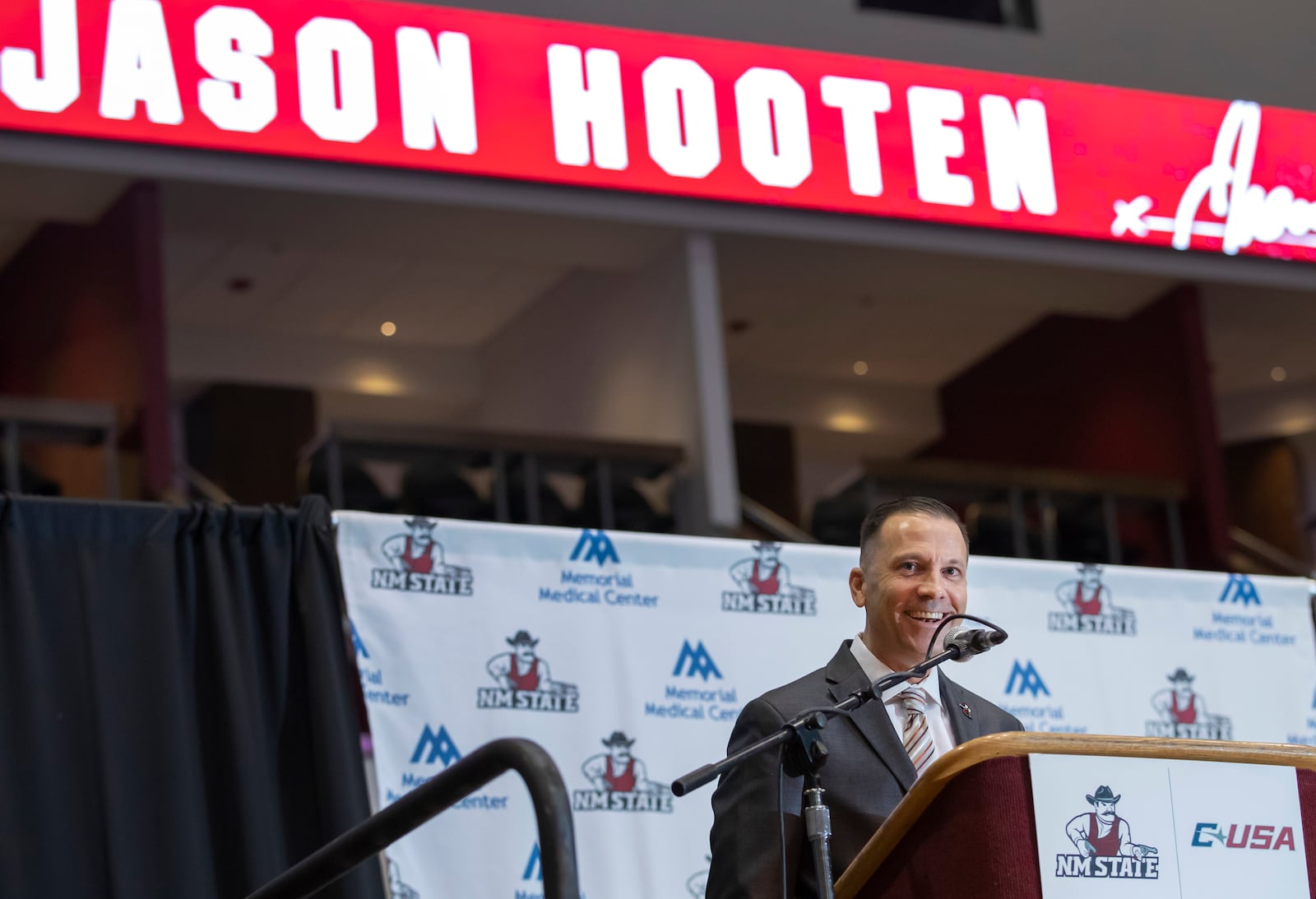 Newly appointed New Mexico State NCAA college basketball coach Jason Hooten speaks during his introduction event in Las Cruces, N.M., Sunday, March 26, 2023. (AP Photo/Andres Leighton)