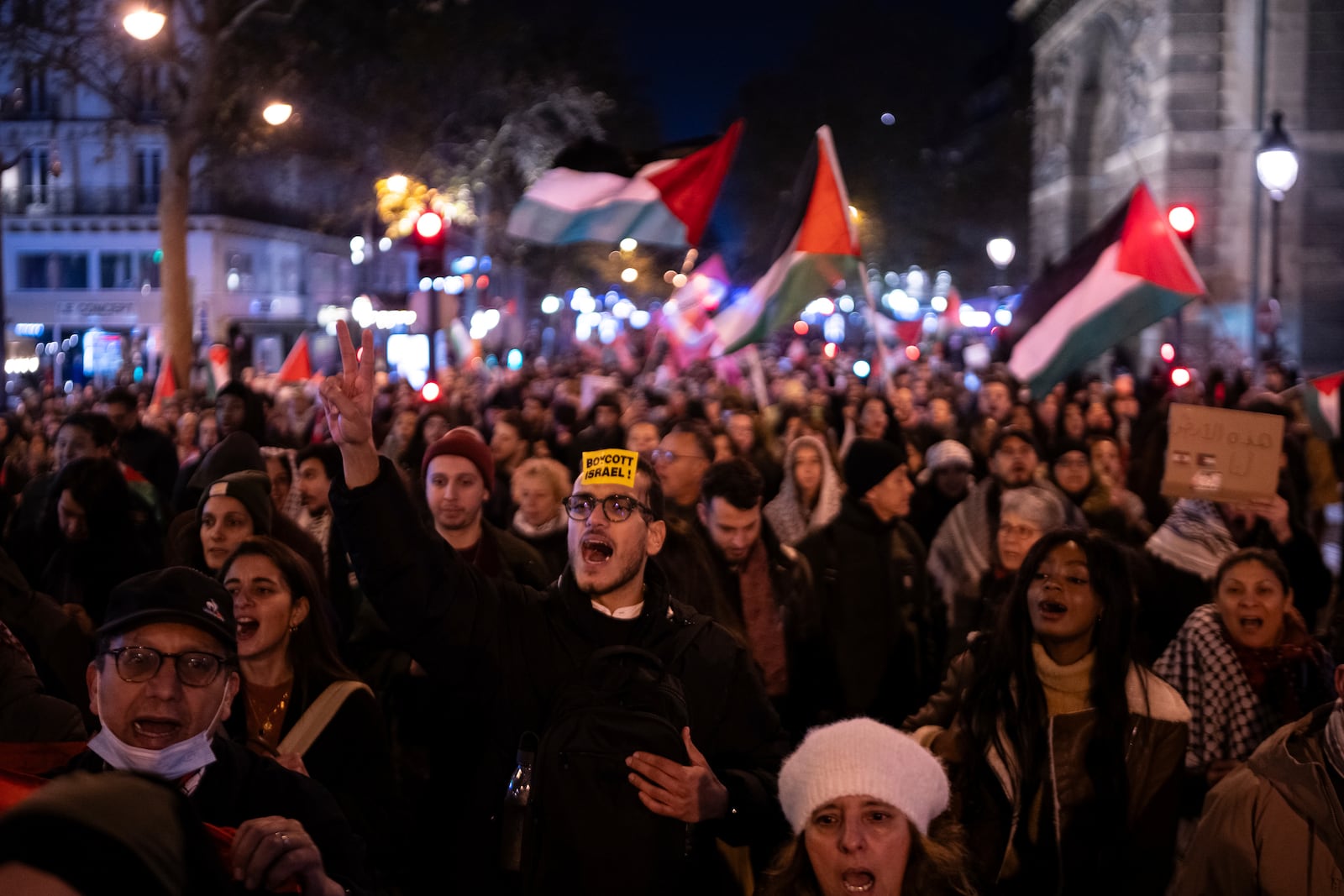 Protestors take part in a rally against the "Israel is Forever" gala organized by far-right Franco-Israeli figures, in Paris, Wednesday, Nov. 13, 2024, on the eve of the UEFA Nations League 2025 soccer match between France and Israel. (AP Photo/Louise Delmotte)