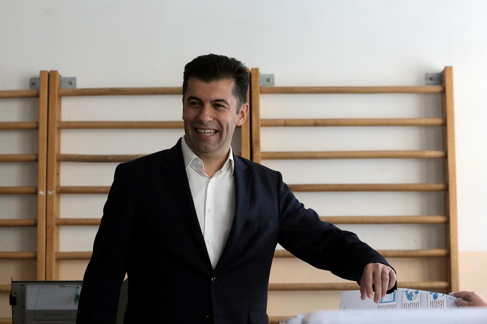 Former Bulgarian Prime Minister Kiril Petkov holds his ballot at a polling station during the general elections in Sofia, Sunday, Oct. 27, 2024. (AP Photo/Valentina Petrova)