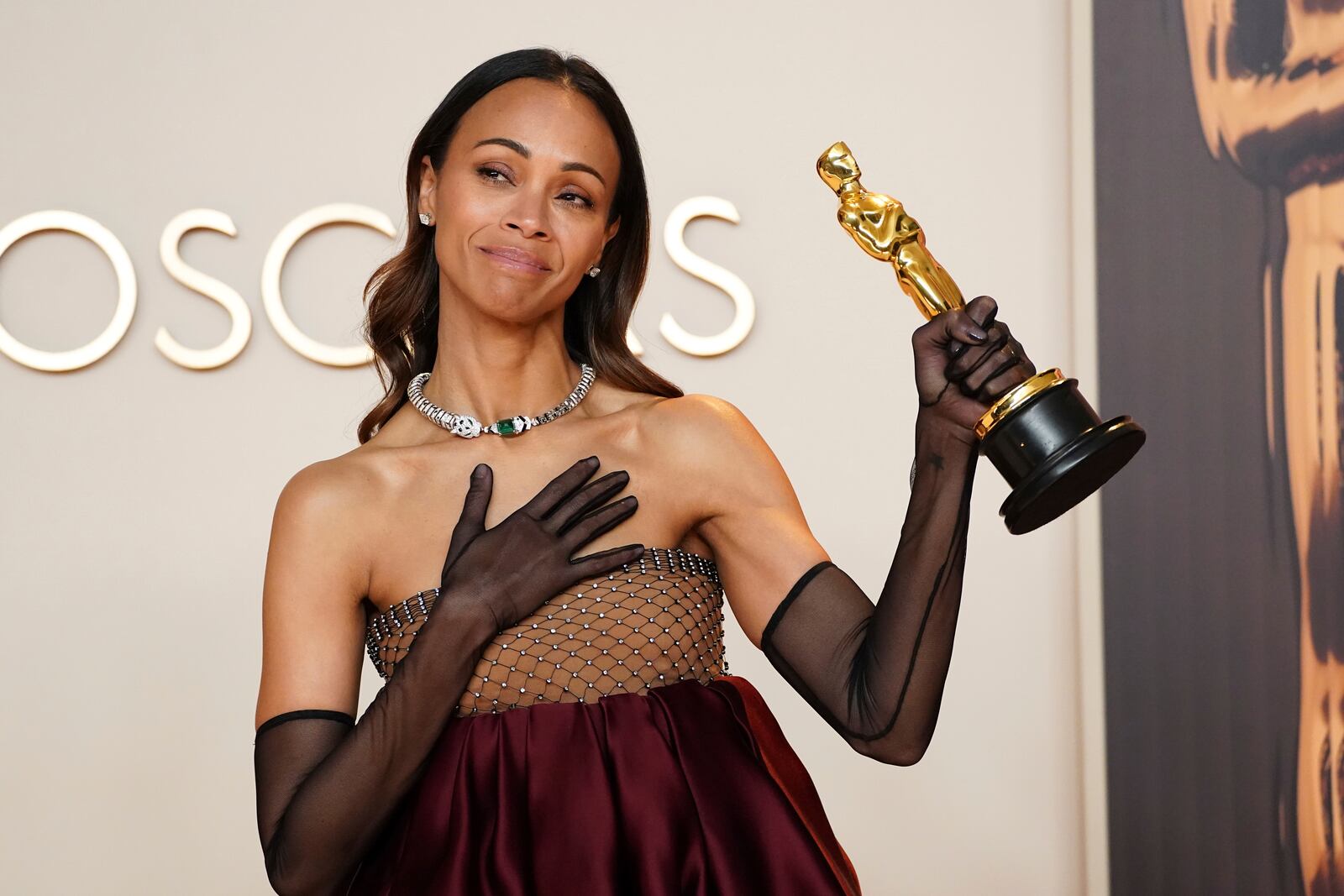 Zoe Saldana, winner of the award for best performance by an actress in a supporting role for "Emilia Perez," poses in the press room at the Oscars on Sunday, March 2, 2025, at the Dolby Theatre in Los Angeles. (Photo by Jordan Strauss/Invision/AP)