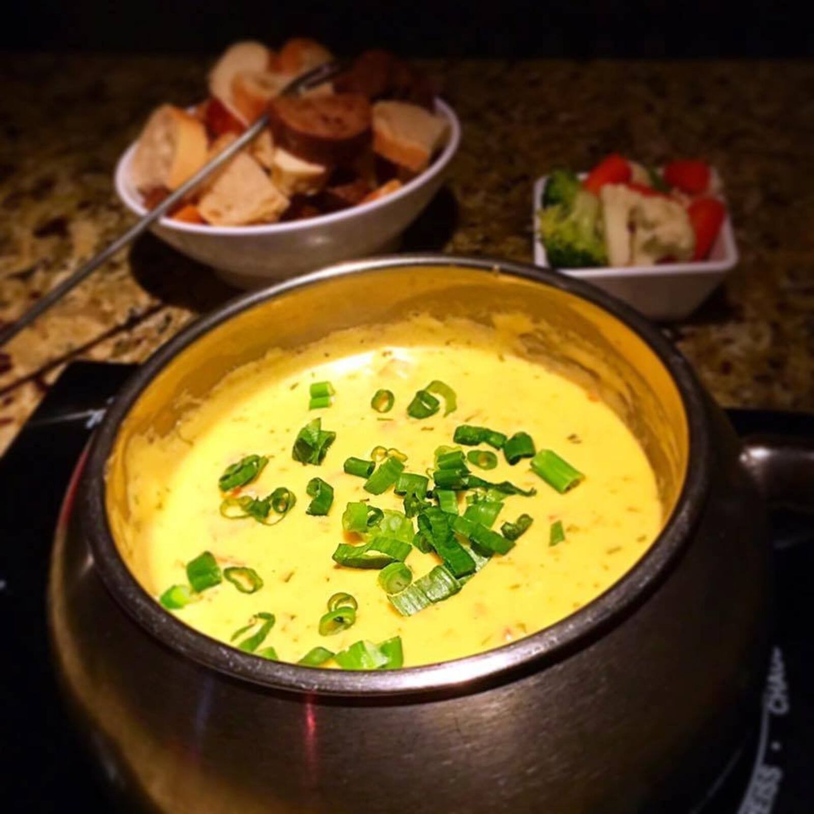 Green Goddess Cheddar Cheese Fondue at the Melting Pot. CONTRIBUTED