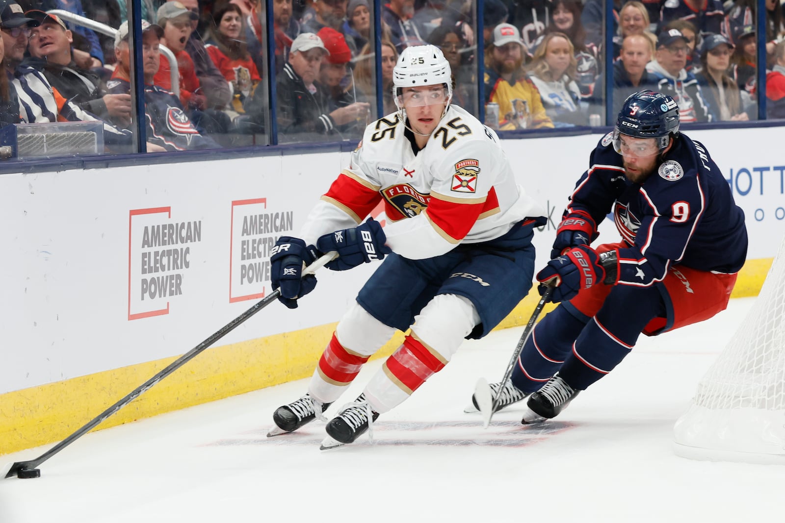 Florida Panthers' Mackie Samoskevich, left, skates past Columbus Blue Jackets' Ivan Provorov during the first period of an NHL hockey game, Tuesday, Oct. 15, 2024, in Columbus, Ohio. (AP Photo/Jay LaPrete)