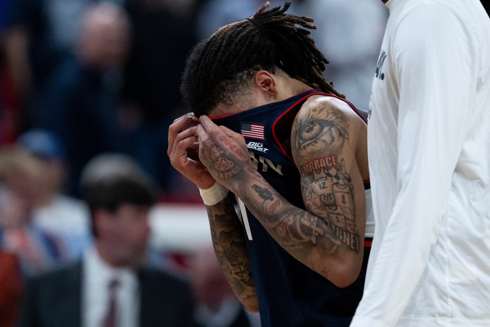 Connecticut guard Solo Ball reacts to his team's loss to Florida in the second round of the NCAA college basketball tournament, Sunday, March 23, 2025, in Raleigh, N.C. (AP Photo/Stephanie Scarbrough)