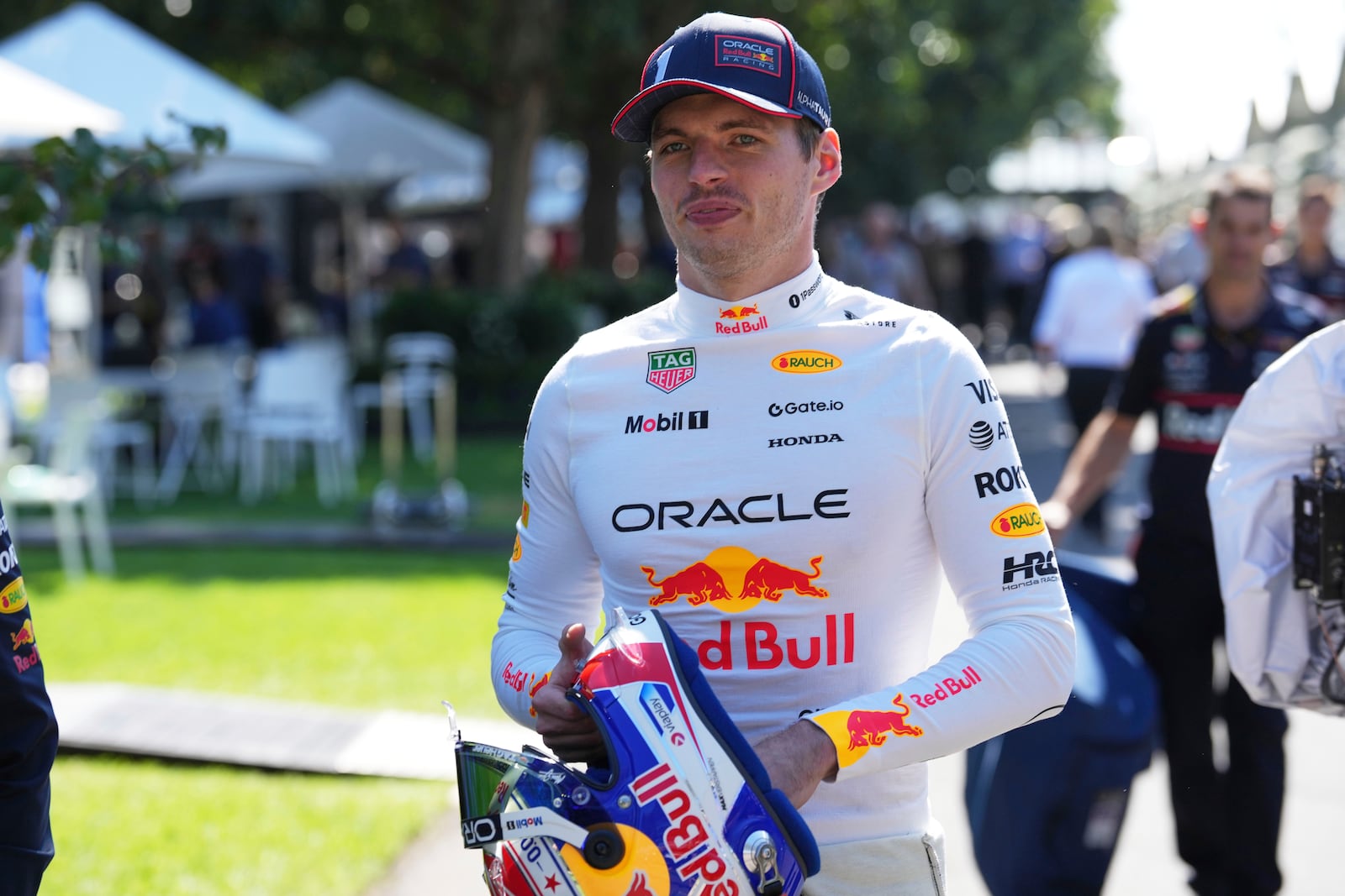 Red Bull driver Max Verstappen of the Netherlands walks through the paddock ahead of the Australian Formula One Grand Prix at Albert Park, in Melbourne, Australia, Thursday, March 13, 2025. (AP Photo/Heath McKinley)