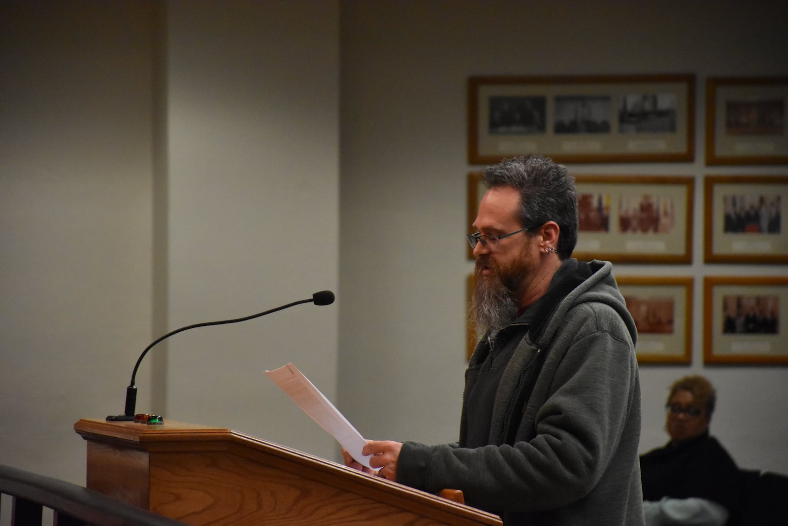 Doug Underwood, 44, who lives in Dayton's Edgemont neighborhood, speaks at a Dayton City Commission meeting. He said he hears more than 190 train horns at his home every day. CORNELIUS FROLIK / STAFF