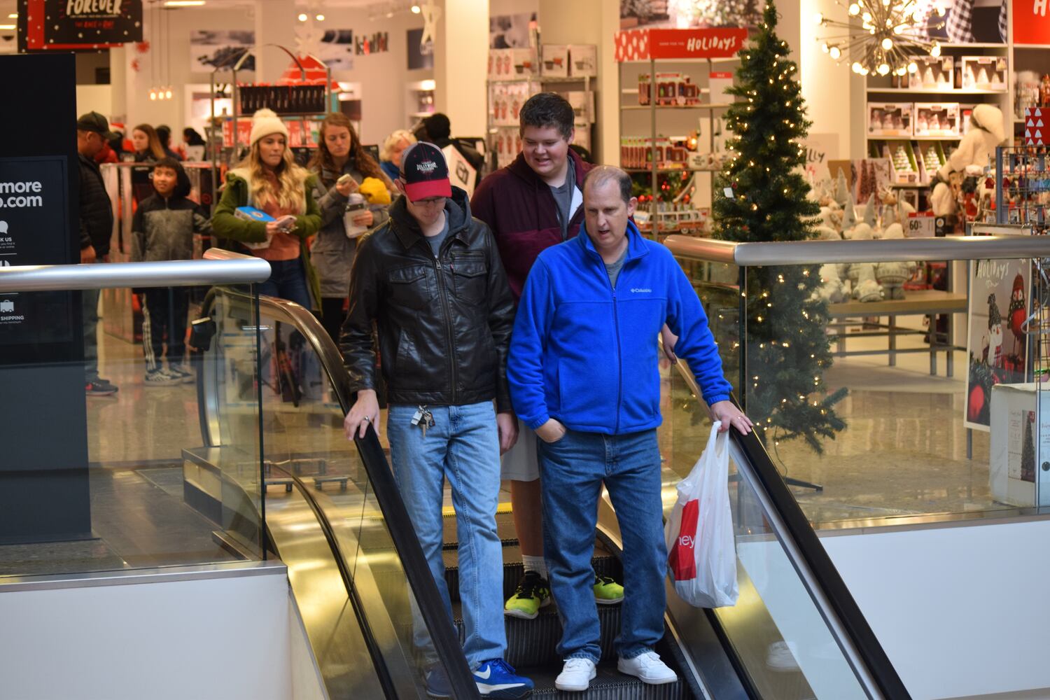 PHOTOS: Hundreds like up outside JCPenney for doorbusters, coupons