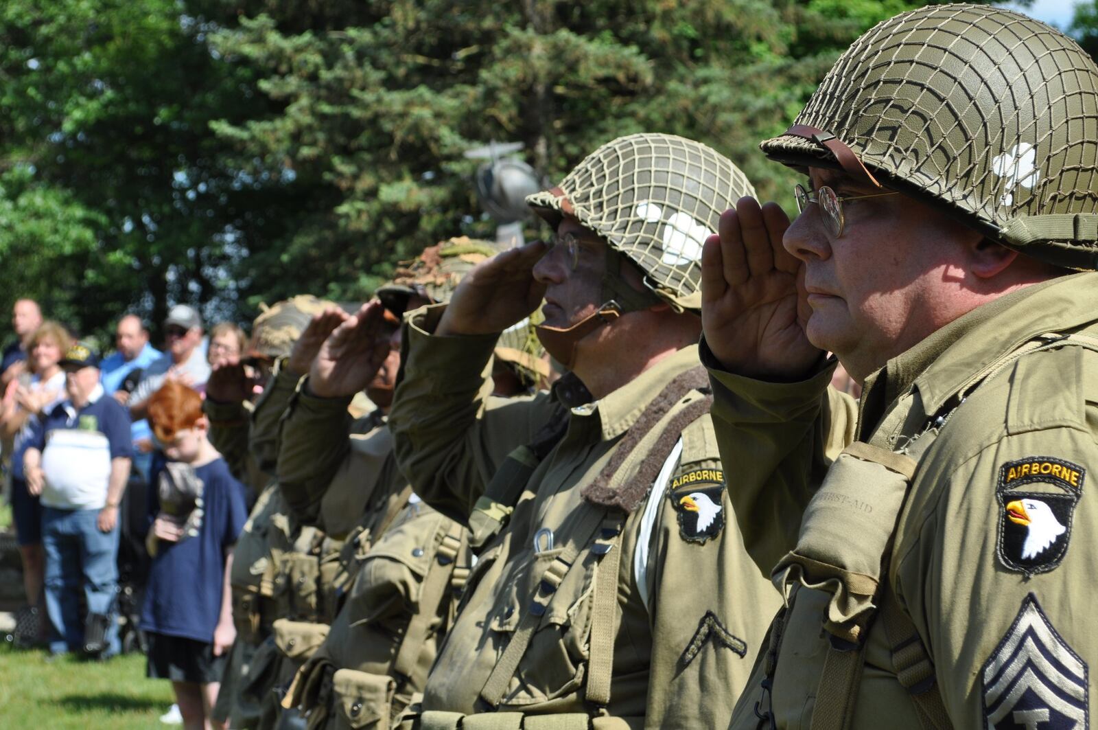 World War II re-enactors salute during a ceremony at Memorial Park of the National Museum of the U.S. Air Force on Thursday. The ceremony was part of a wide range of events the museum hosted to commemorate the 75th anniversary of D-Day.