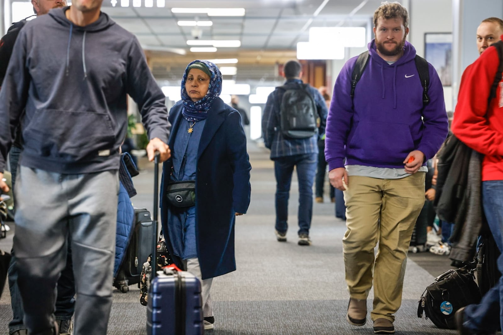 Travelers make their way through Dayton International Airport terminal Friday, Nov. 22, 2024. AAA projects 4.9 million Ohioans will travel over the 10-day year-end holiday travel period, a 2.9% increase over 2023 that surpassed a pre-pandemic number of 4.8 million and sets a new record. JIM NOELKER/STAFF