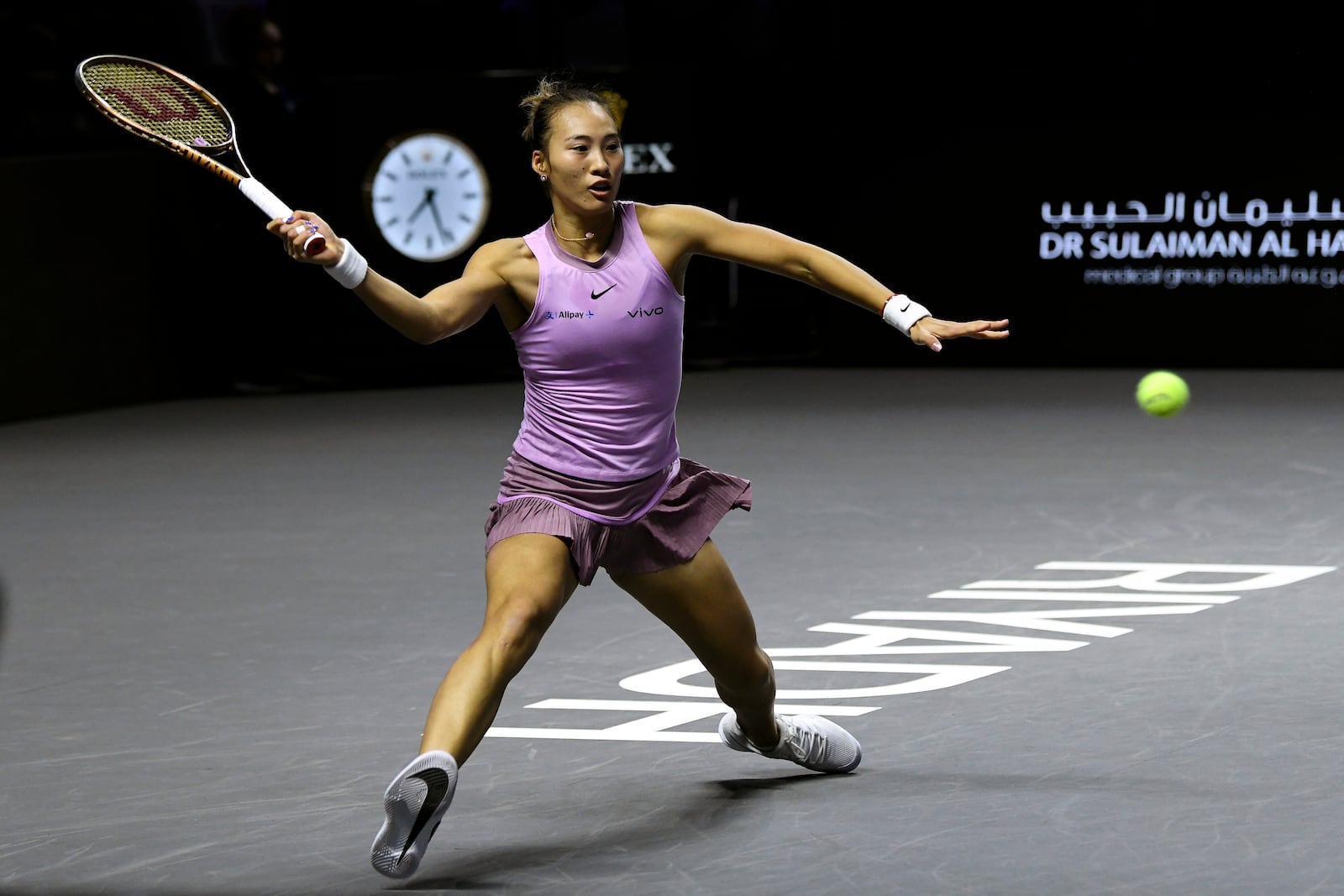 China's Qinwen Zheng plays a shot against Coco Gauff of the U.S. during their women's singles final match of the WTA finals at the King Saud University Indoor Arena, in Riyadh, Saudi Arabia, Saturday, Nov. 9, 2024. (AP Photo)