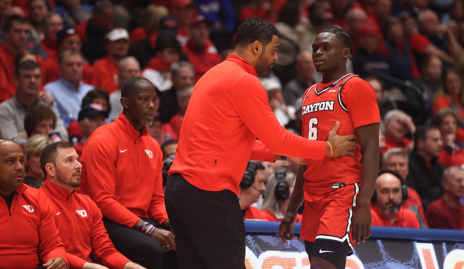 Dayton's Ricardo Greer talks to Enoch Cheeks during a game against Virginia Commonwealth on Friday, Feb. 7, 2025, at UD Arena.. David Jablonski/Staff