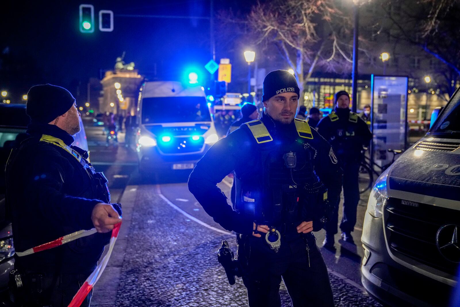 Police officers attend the scene at the Holocaust memorial after a man was attacked at the memorial site in Berlin, Germany, Friday, Feb. 21, 2025. (AP Photo/Ebrahim Noroozi)