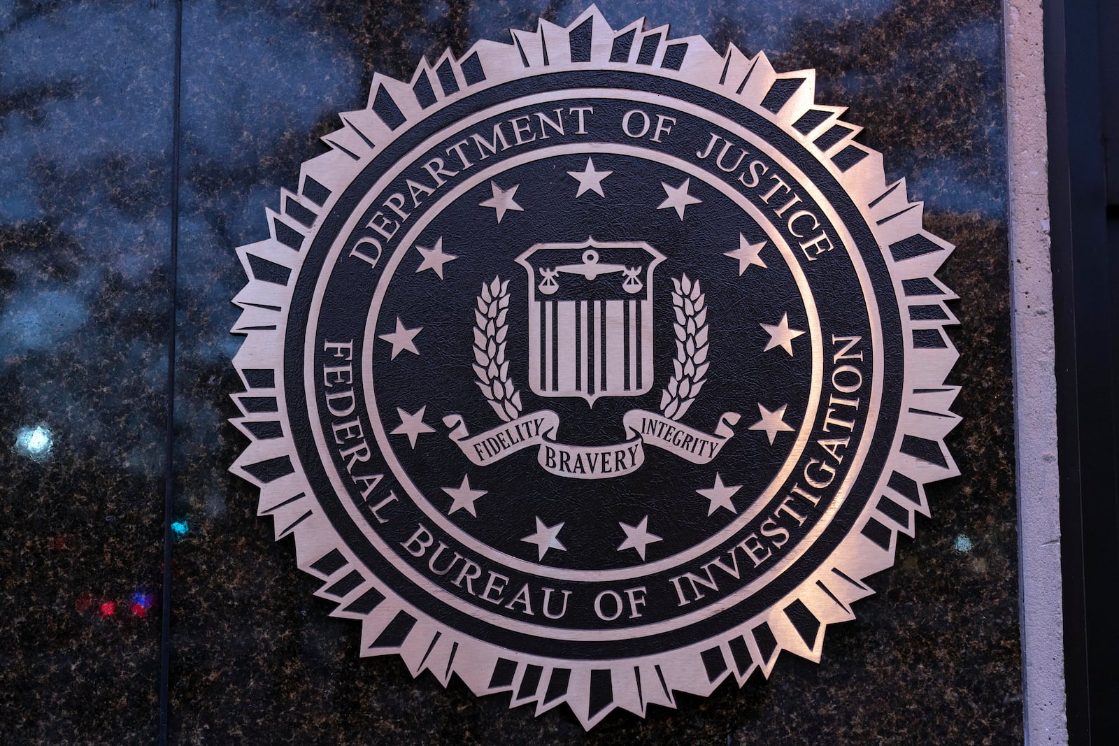 FILE - The seal of theFederal Bureau of Investigation (FBI) is seen on the Headquarters in Washington, Saturday, Dec. 7, 2024. (AP Photo/Jose Luis Magana, File)