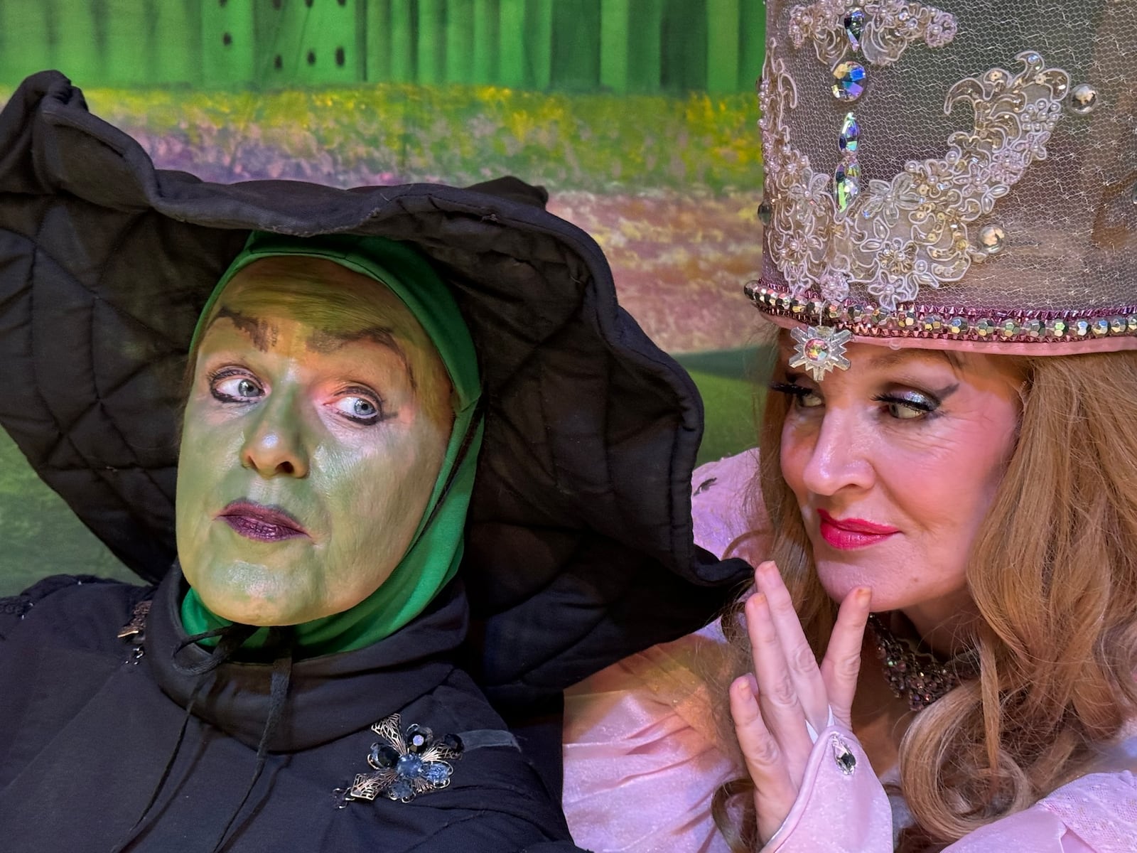 Cheryl Salzman (Wicked Witch of the West) and Karie-Lee Sutherland (Glinda) in La Comedia Dinner Theatre's production of "The Wizard of Oz." PHOTO BY JUSTIN WALTON