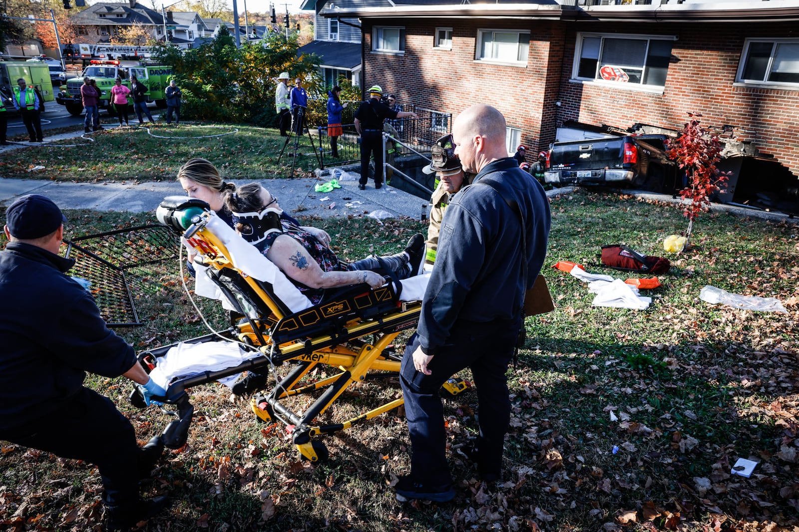 A pickup truck crashed into an apartment building at Wayne and Wilmington avenues Thursday, Oct. 27, 2022, in Dayton, injuring two people sitting on a couch in an apartment and two people in the truck. JIM NOELKER/STAFF