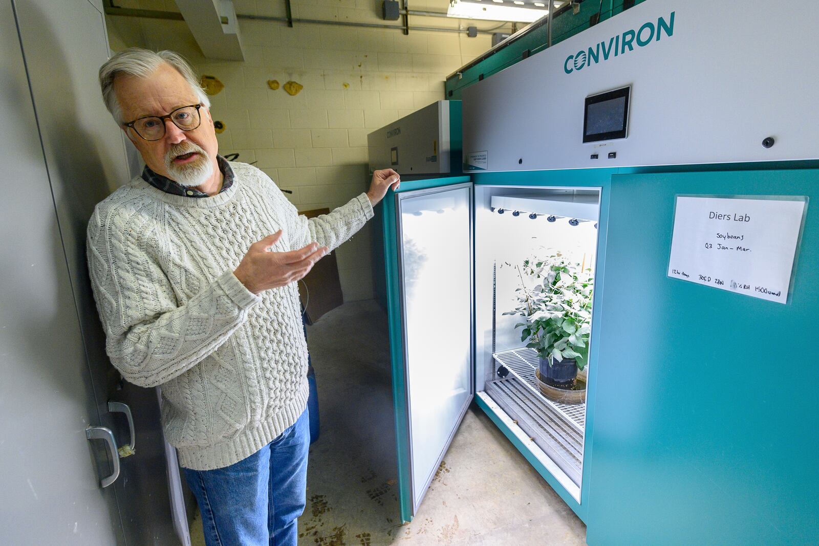 Dr. Brian Diers, Professor Emeritus, Crop Science and deputy director of the Soybean Innovation Lab, speaks at the soybean growing chamber, Thursday, Feb. 13, 2025, in Champaign, Ill. (AP Photo/Craig Pessman)