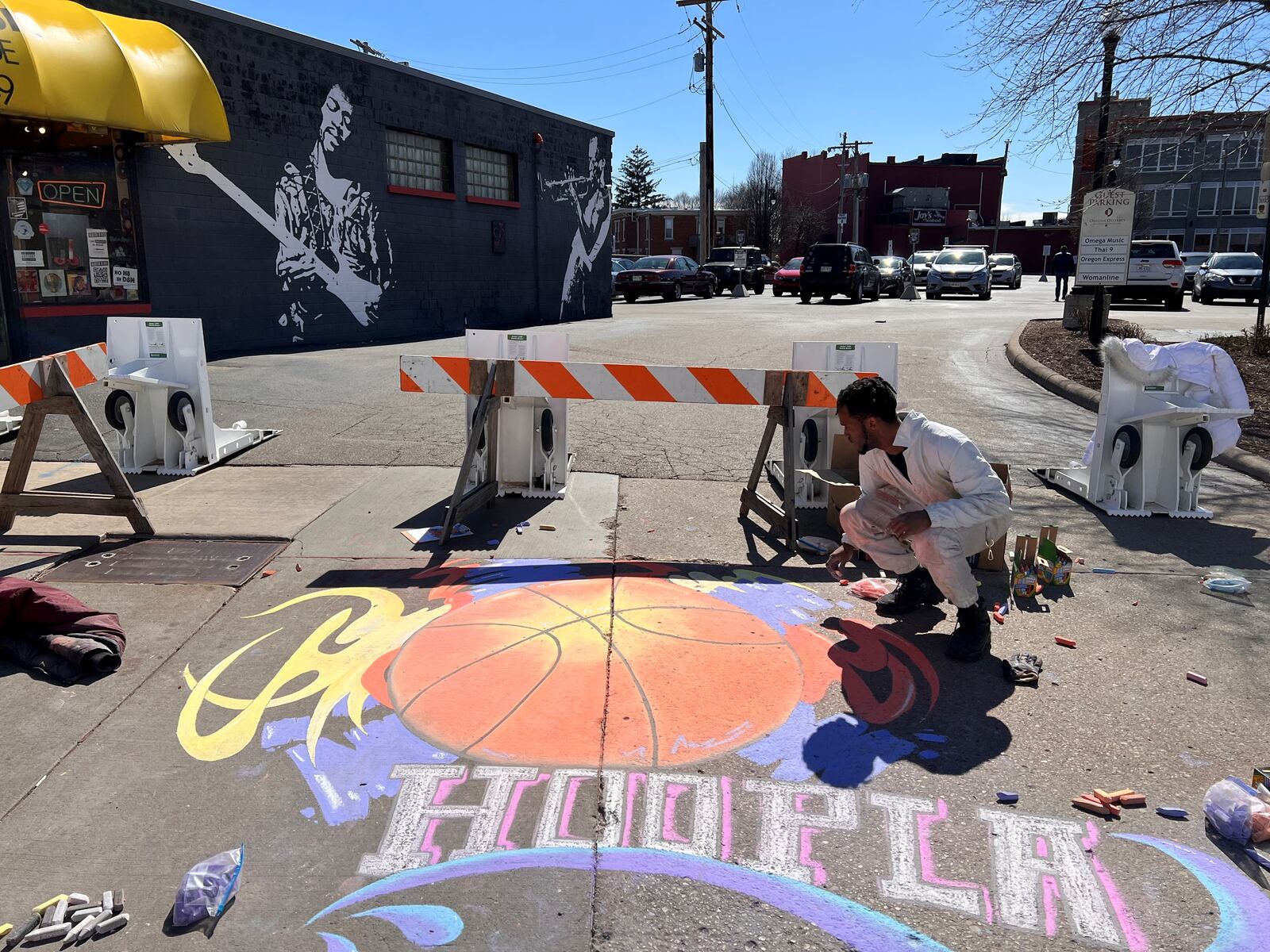 Local artist Ben “Boy Blue” Baugham puts the finishing touches on a chalk drawing during the Big Hoopla Family Festival in The Oregon District on Sunday, Mar. 13, 2022 TOM GILLIAM / CONTRIBUTING PHOTOGRAPHER