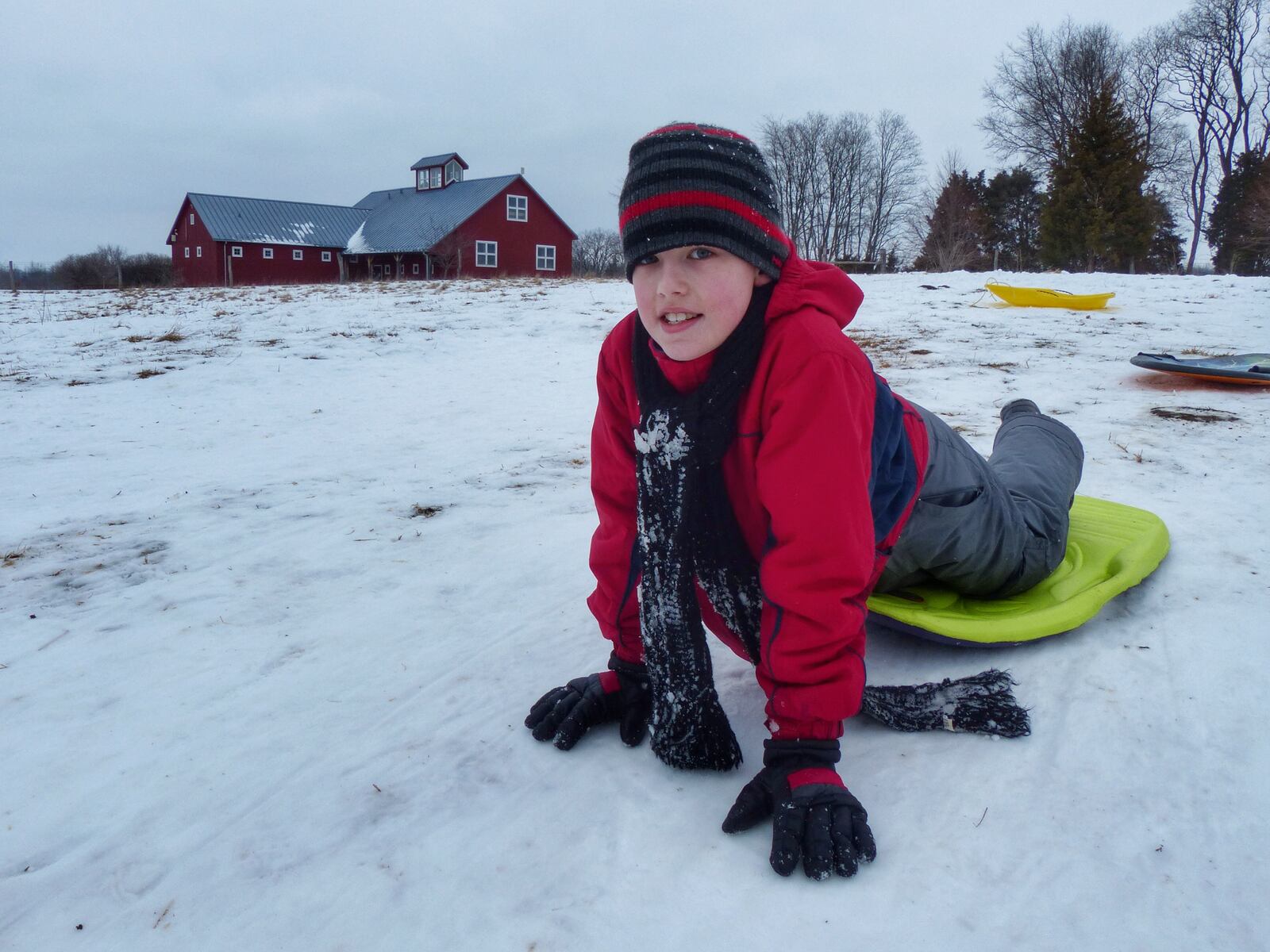 Eric Feider, 8, of Fairborn sleds at Carriage Hill MetroPark in Huber Heights on MLK Day. CONNIE POST/STAFF