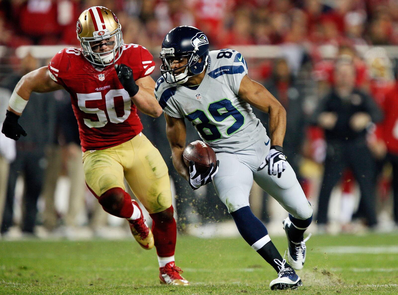 SANTA CLARA, CA - NOVEMBER 27: Wide receiver Doug Baldwin #89 of the Seattle Seahawks takes a pass for a 24-yard gain against linebacker Chris Borland #50 of the San Francisco 49ers in the first quarter on November 27, 2014 at Levi’s Stadium in Santa Clara, California. The Seahawks won 19-3. (Photo by Brian Bahr/Getty Images)