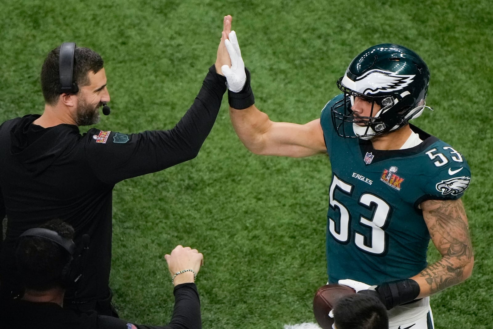 Philadelphia Eagles linebacker Zack Baun (53) celebrates after an interception with head coach Nick Sirianni during the first half of the NFL Super Bowl 59 football game against the Kansas City Chiefs, Sunday, Feb. 9, 2025, in New Orleans. (AP Photo/Charlie Riedel)