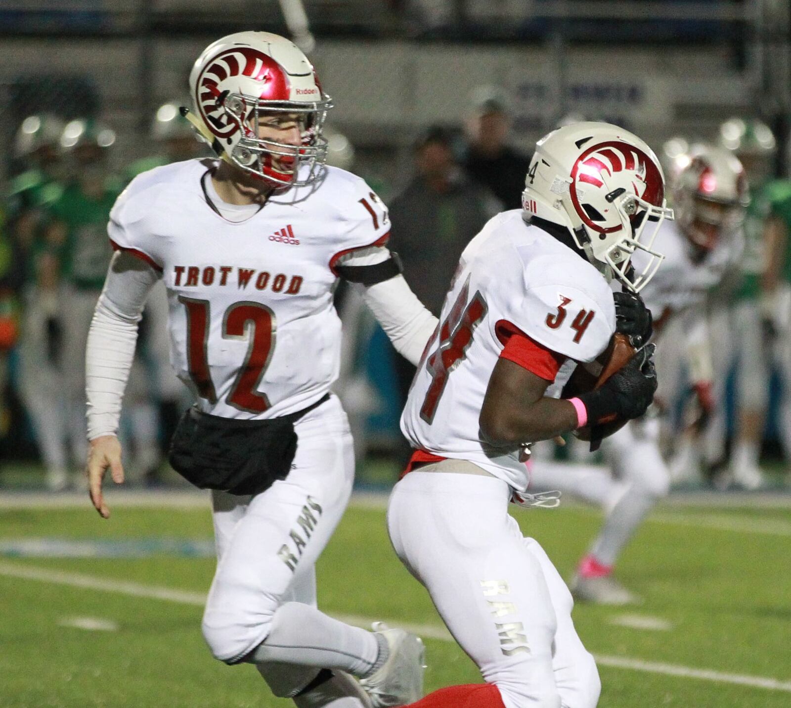 Trotwood-Madison junior QB Cooper Stewart hands off to freshman leading rusher Hezekiah Hudson-Davis. Trotwood (11-3) will play Mansfield Senior (13-1) in the D-III state championship at Canton on Friday, Dec. 6, 2019. MARC PENDLETON / STAFF