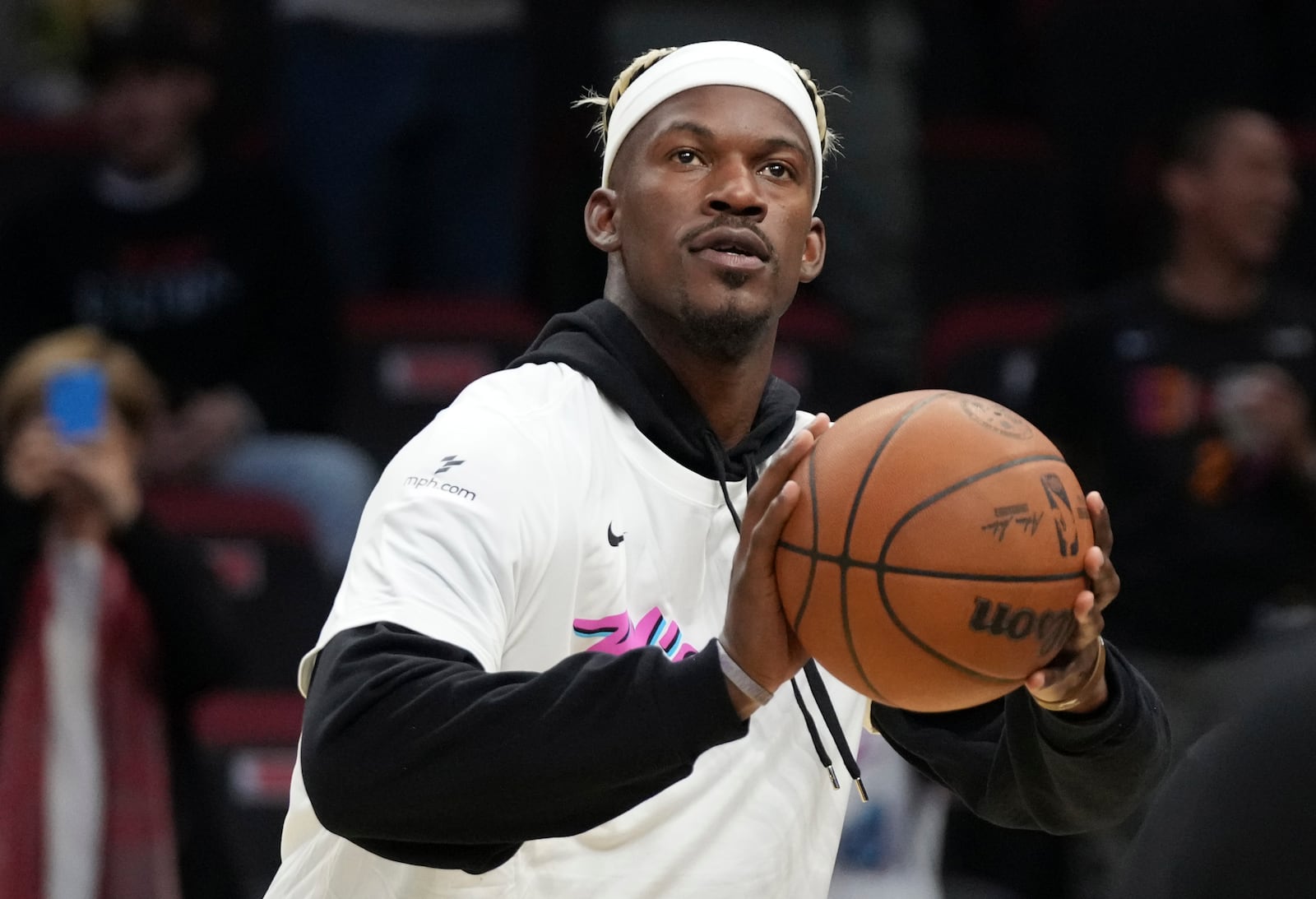 Miami Heat forward Jimmy Butler warms up before an NBA basketball game against the Denver Nuggets, Friday, Jan. 17, 2025, in Miami. (AP Photo/Lynne Sladky)