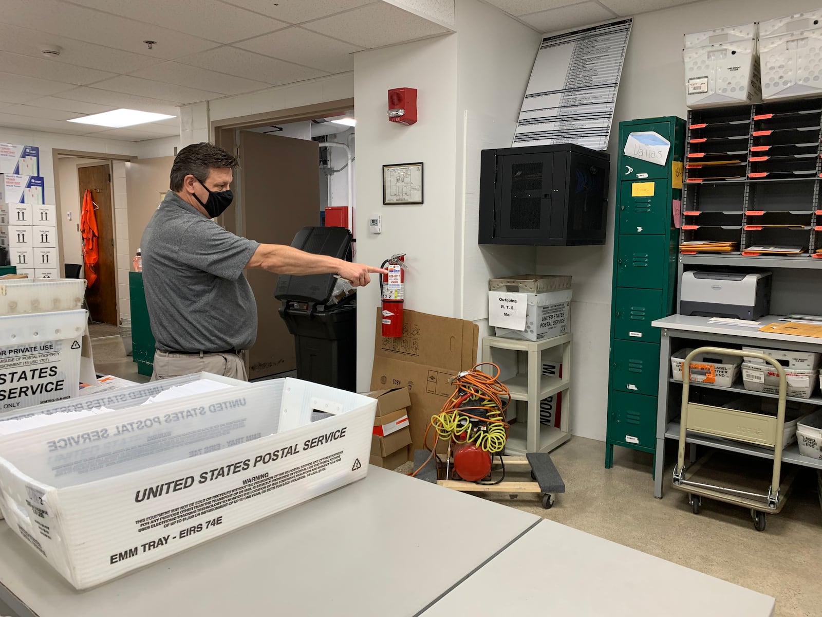 Montgomery County Board of Elections Deputy Director Steve Harsman displays where mailed absentee ballots are delivered to the board of elections Wednesday, Oct. 28.