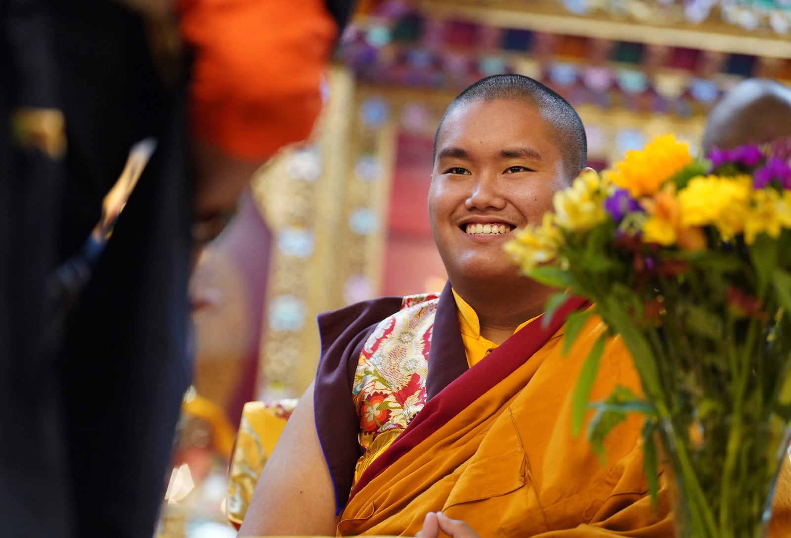 U.S.-born Buddhist lama, Jalue Dorje, is presented with “khata,” the Tibetan ceremonial scarves that symbolize auspiciousness, at his 18th birthday and enthronement ceremony, in Isanti, Minn., on Saturday, Nov. 9, 2024. (AP Photo/Jessie Wardarski)