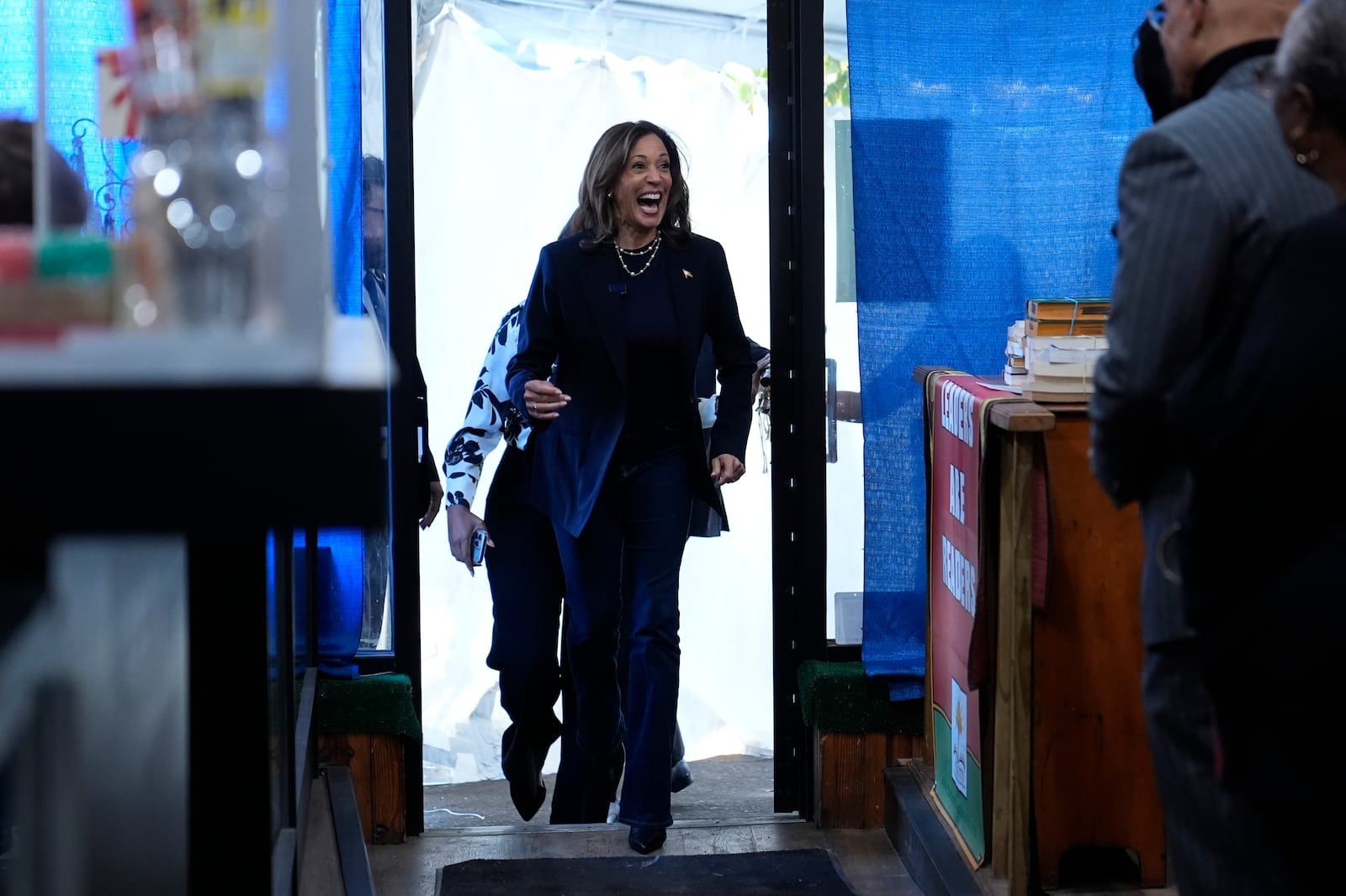 Democratic presidential nominee Vice President Kamala Harris arrives at Hakim's Bookstore and Gift Shop during a campaign stop, Sunday, Oct. 27, 2024, in Philadelphia. (AP Photo/Susan Walsh)