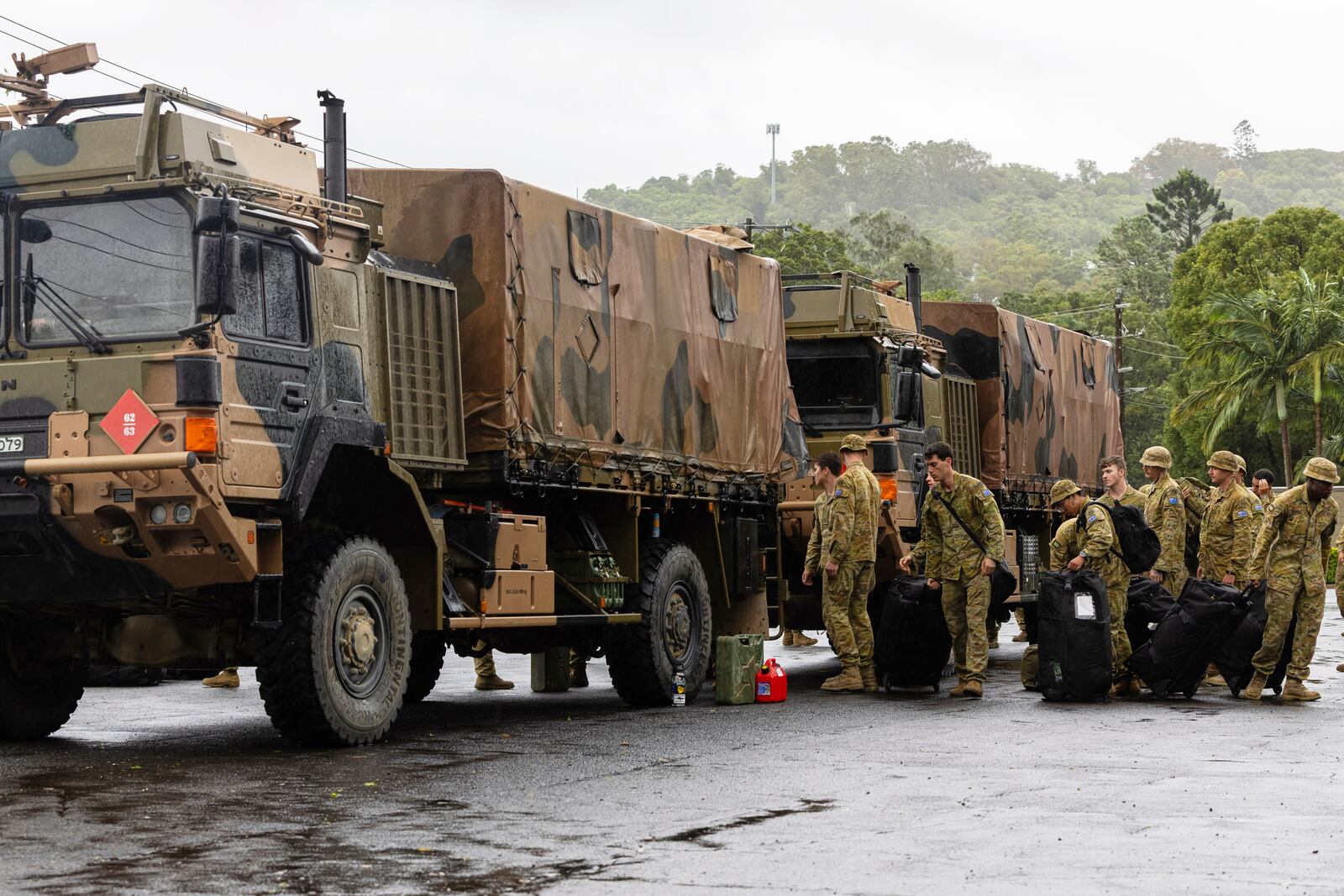 Australian Army soldiers from 8th/9th Battalion arrive in Lismore, Australia, Friday, March 7, 2025 to assist northern New South Wales communities in the wake of Tropical Cyclone Alfred. (WO2 Raymond Vance/Australian Defence Dept. via AP)