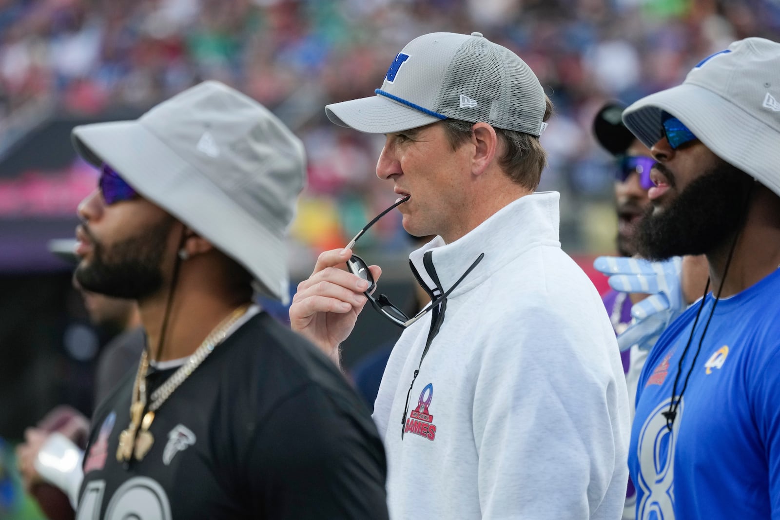 NFC coach Eli Manning, center, watches from the sideline during the flag football event at the NFL Pro Bowl, Sunday, Feb. 2, 2025, in Orlando. (AP Photo/John Raoux)