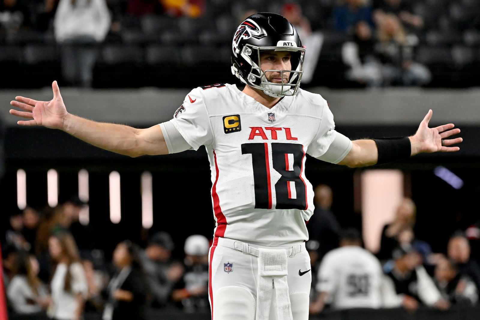 Atlanta Falcons quarterback Kirk Cousins (18) stretches prior to an NFL football game against the Las Vegas Raiders, Monday, Dec. 16, 2024, in Las Vegas. (AP Photo/David Becker)