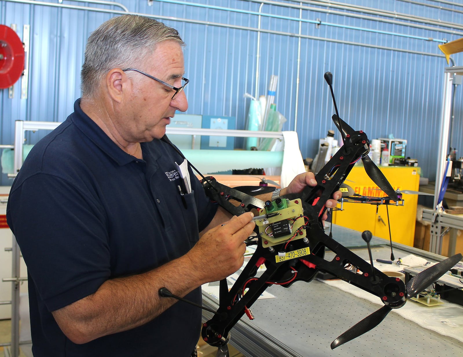 Frank Beafore, owner of SelectTech, works on a UAV Friday. Clark State adds to its ag precision program. Jeff Guerini/Staff