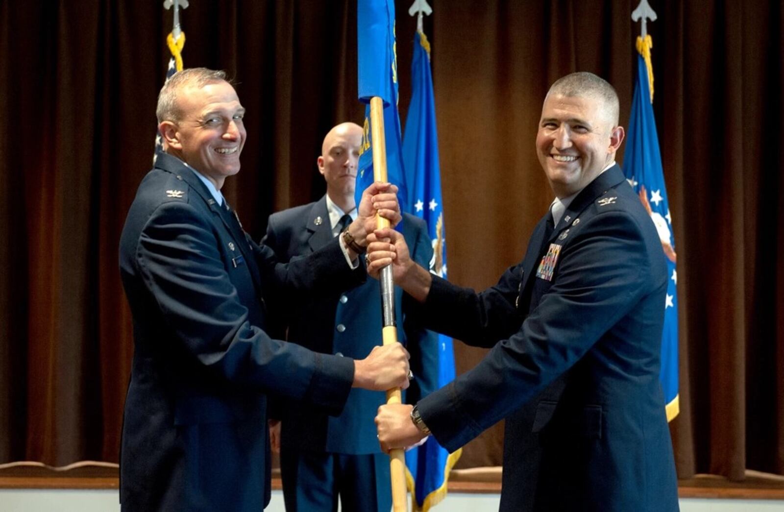 Air Force Col. Kenneth Stremmel, left, took command of the Global Exploitation Intelligence Group, National Air and Space Intelligence Center, Wright-Patterson Air Force Base, Ohio, July 14, 2021. Air Force photo