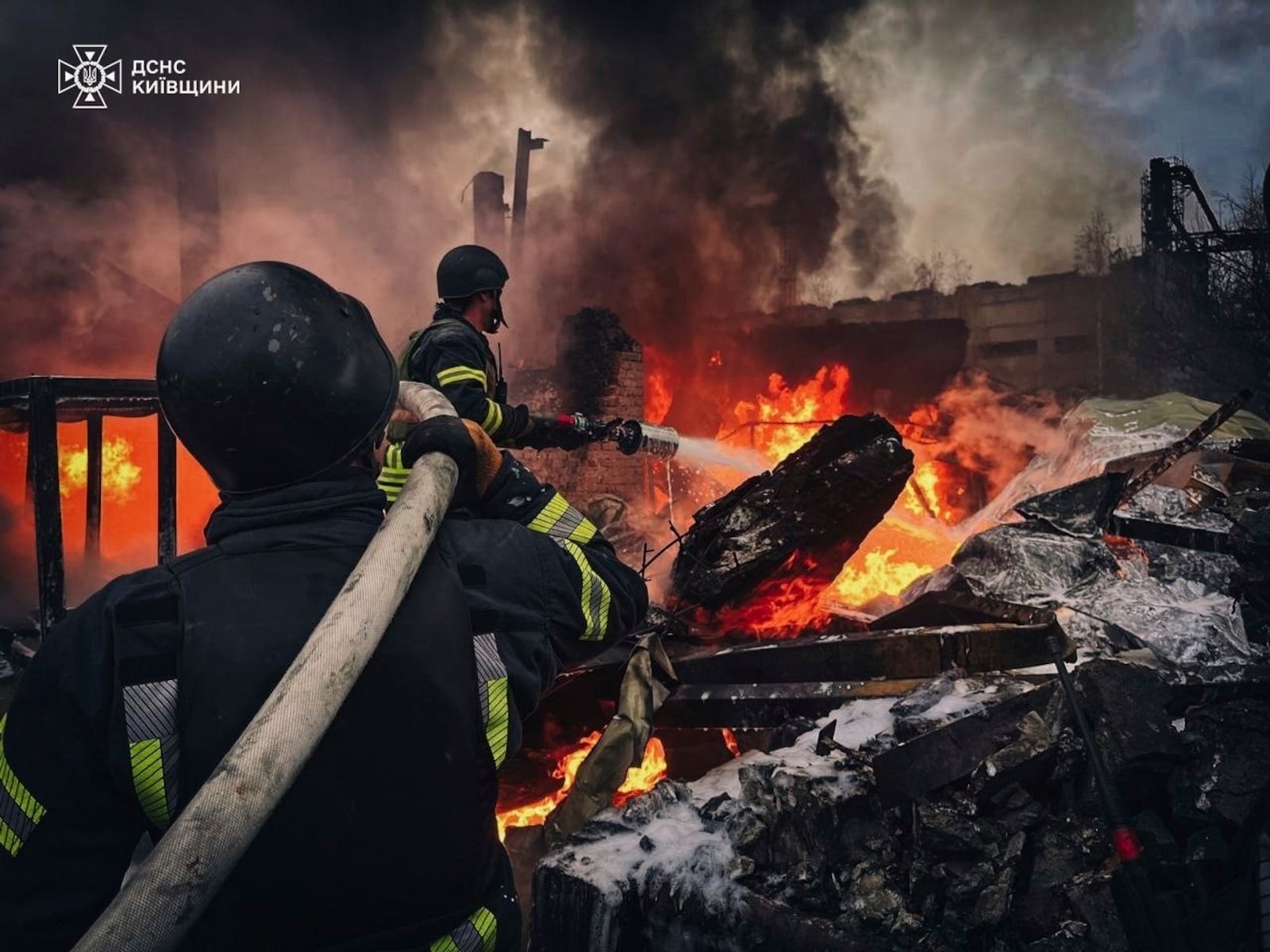 In this photo provided by the Ukrainian Emergency Service on Nov. 13, 2024, Rescue workers put out a fire of a building which was destroyed by a Russian strike in Brovary, outside Kyiv, Ukraine. (Ukrainian Emergency Service via AP)