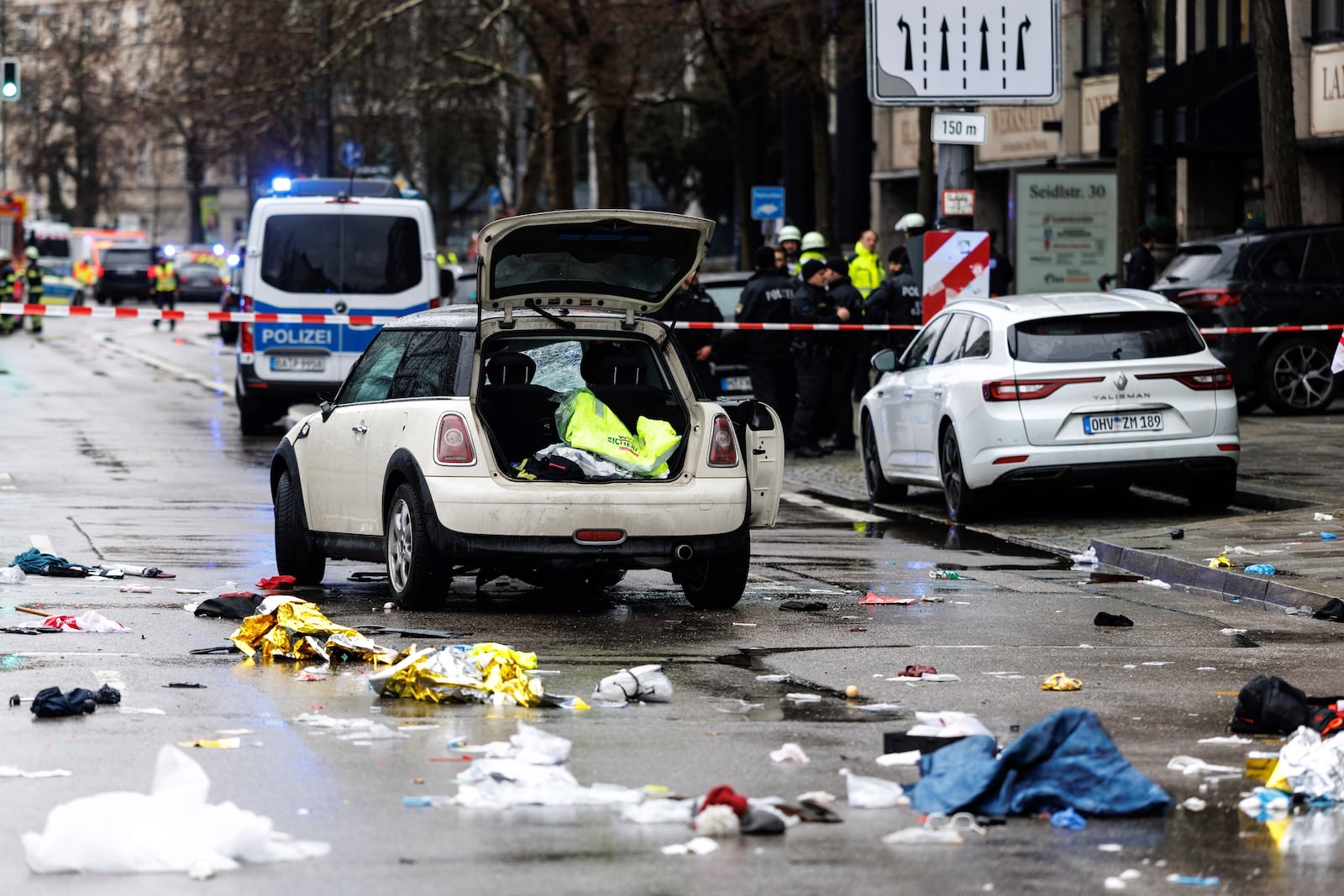 Emergency services attend the scene of an accident after a driver hit a group of people in Munich, Germany, Thursday Feb. 13, 2025. (Matthias Balk/dpa via AP)