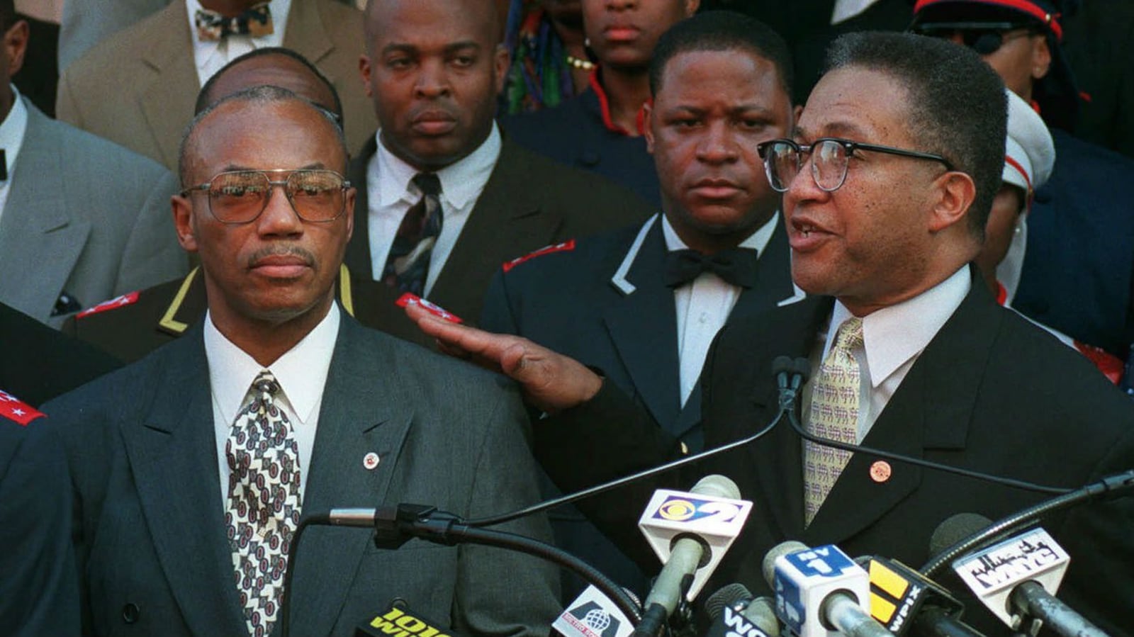 Alleged Malcolm X assassin Muhammad Abdul Aziz, left, is introduced by Minister Benjamin Muhammad, right, in March 1998 as the new head of Harlem's Muhammad Mosque No. 7 in Harlem, where Malcolm preached in the 1950s. A recently released Netflix documentary on the 1965 assassination has prompted the Manhattan district attorney to open a review of the case. The documentary theorizes that two of the three men convicted in the case -- including Aziz -- were innocent.