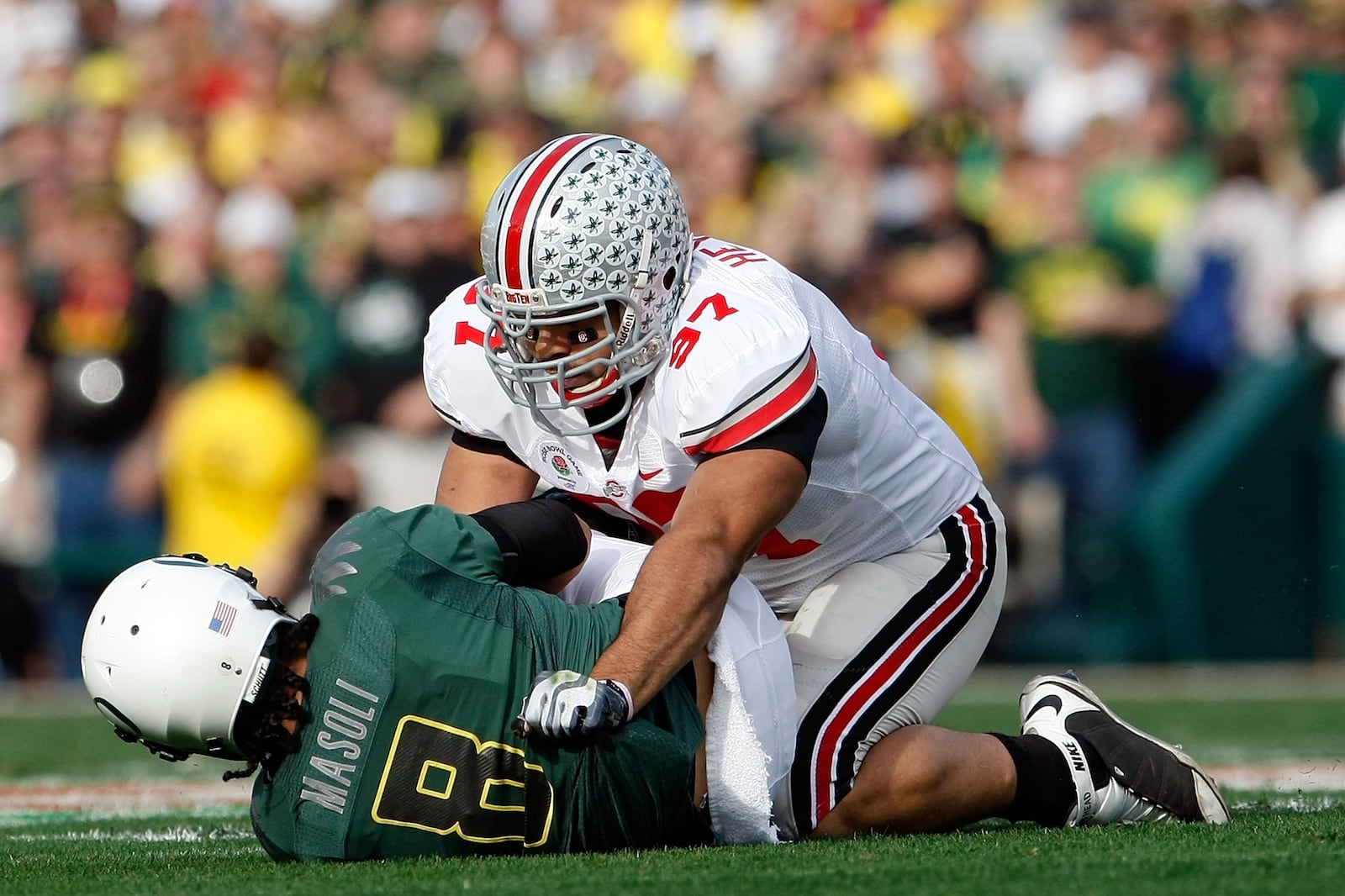 PASADENA, CA - JANUARY 01:  Defensive lineman Cameron Heyward #97 of the Ohio State Buckeyes sacks quarterback Jeremiah Masoli #8 of the Oregon Ducks during the 96th Rose Bowl game on January 1, 2010 in Pasadena, California.  (Photo by Jeff Gross/Getty Images)