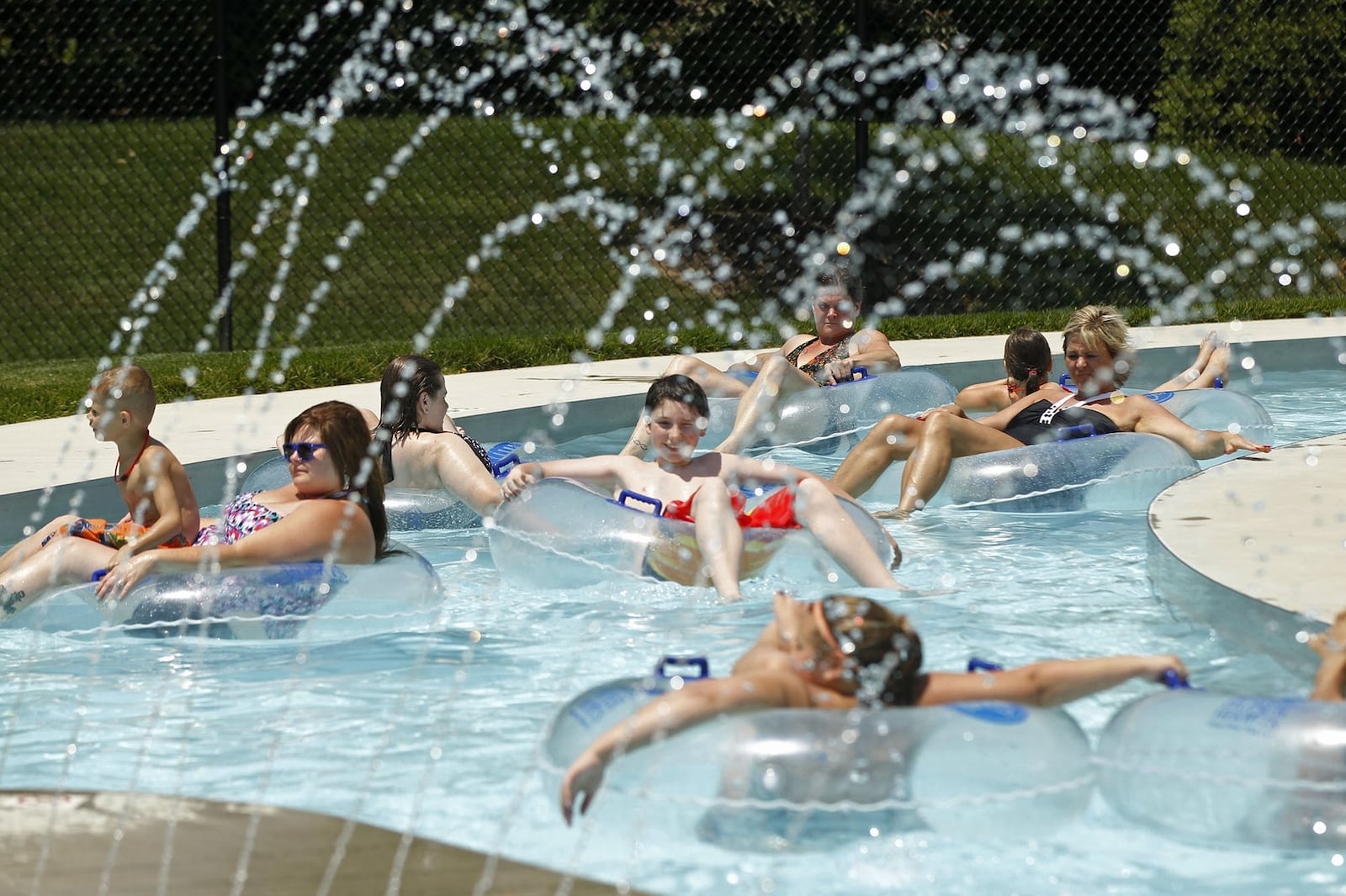 Swimmers at the Kroger Aquatics Center at The Heights float around the Lazy River. TY GREENLEES / STAFF