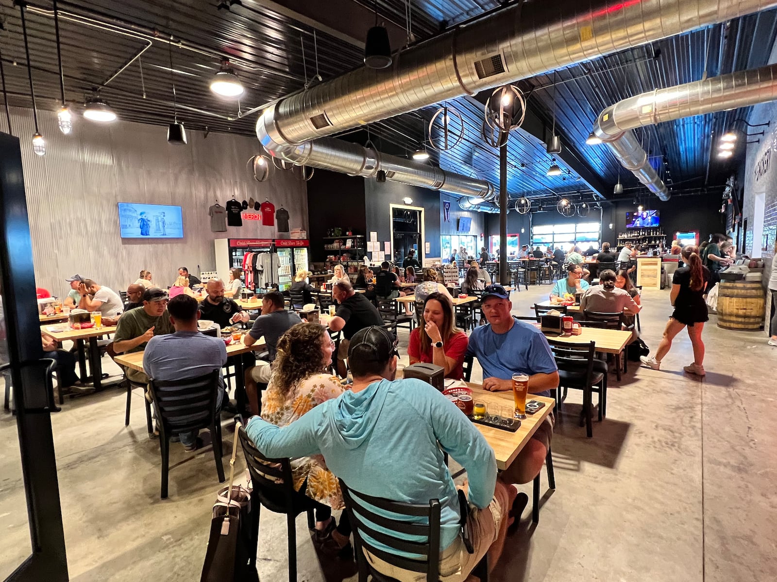 Warped Wing Brewery & Smokery in Huber Heights is an open industrial space with plenty of natural light. ALEXIS LARSEN/CONTRIBUTOR