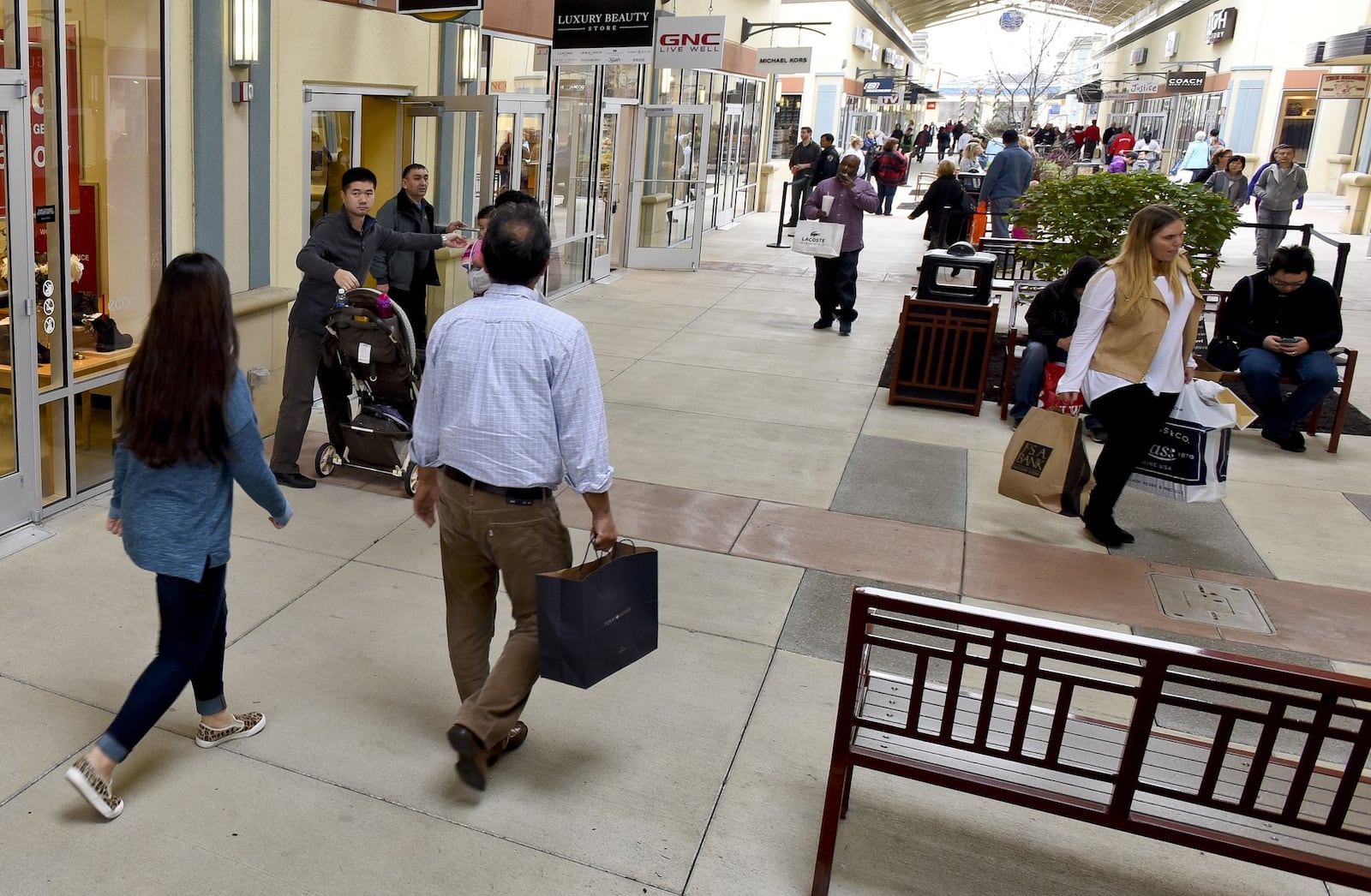 Shoppers look for Black Friday deals at Cincinnati Premium Outlets in Monroe. NICK GRAHAM/STAFF