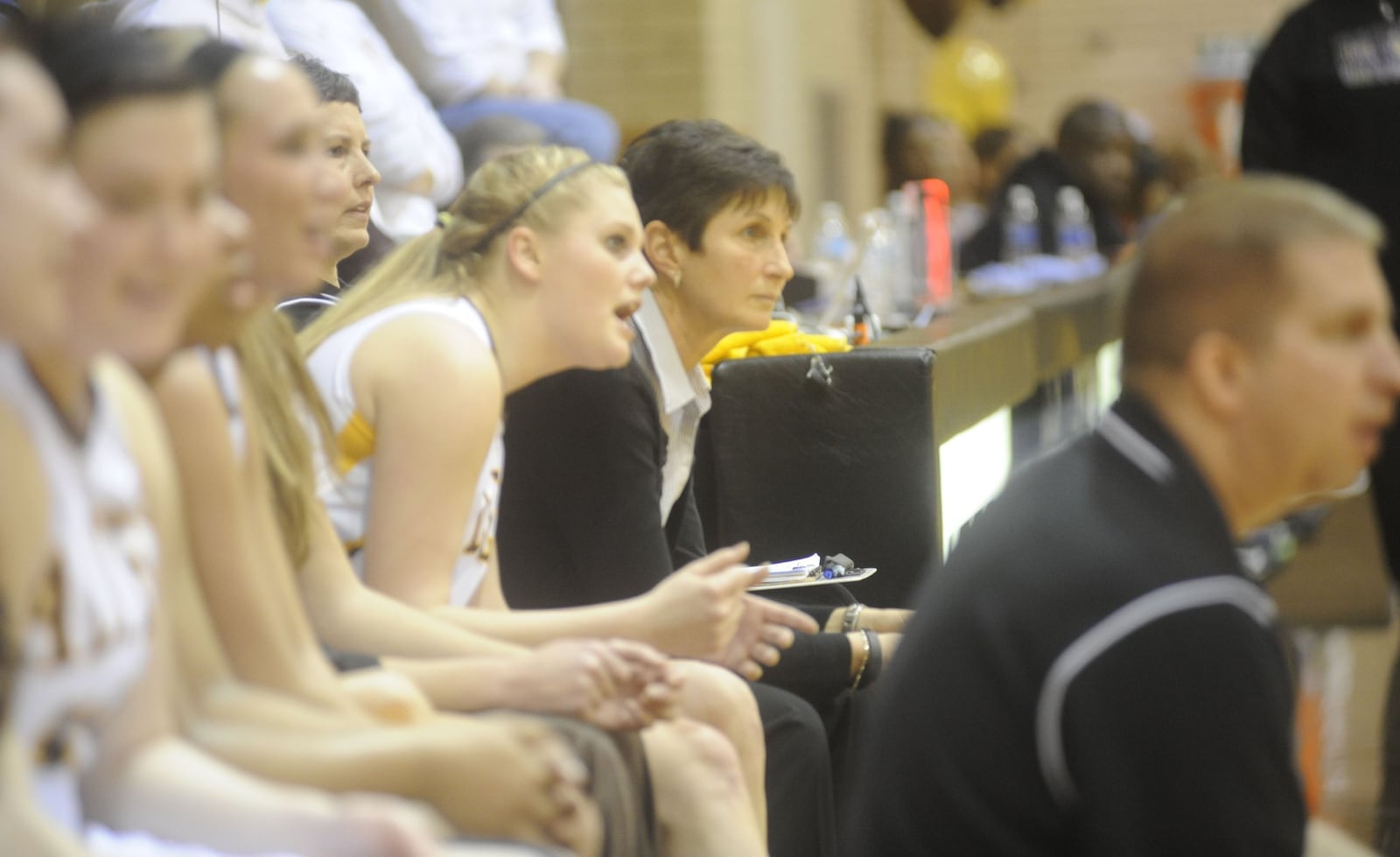 Chris Hart (middle) and Kendel Peck (front) have been unique co-head coaches of the Alter girls basketball program for 15 seasons. MARC PENDLETON / STAFF