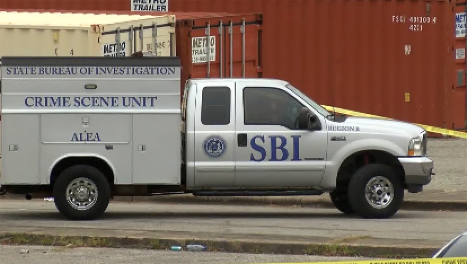 This image taken from video provided by WSFA shows law enforcement working at the scene of a shooting at Tuskegee University, Sunday, Nov. 10, 2024, in Tuskegee, Ala. (WSFA via AP)