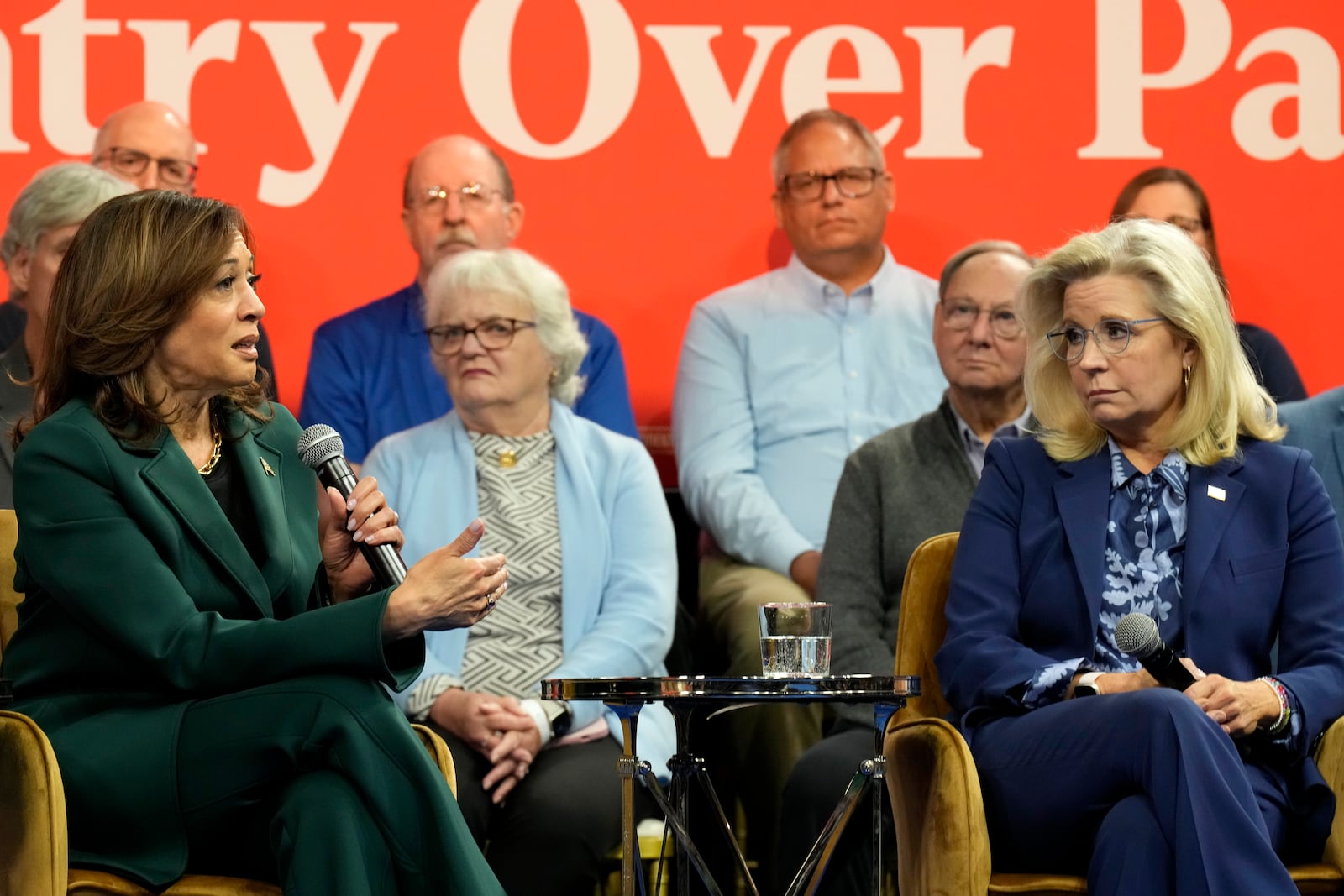 Democratic presidential nominee Vice President Kamala Harris speaks as former Republican Congresswoman Liz Cheney listens during a town hall at The People's Light in Malvern, Pa., Monday, Oct. 21, 2024. (AP Photo/Jacquelyn Martin)