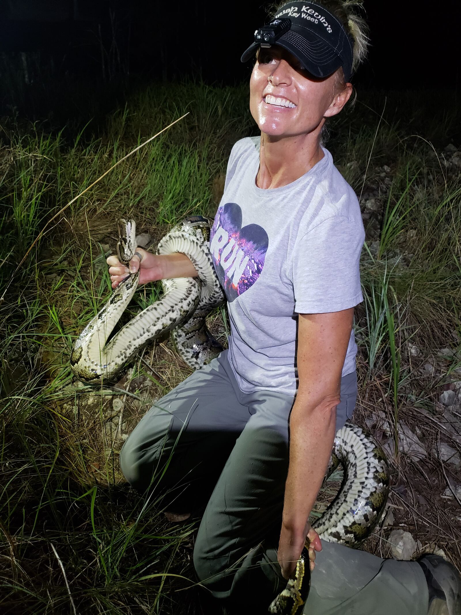 Amy Siewe, a former Fairmont High athlete and Homecoming queen and University of Toledo tennis player, is now a python hunter contracted by the South Florida Water Management District to help rid the Everglades of the invasive pythons that are killing all the animals and birds they come in contact with and wrecking the ecosystem. CONTRIBUTED