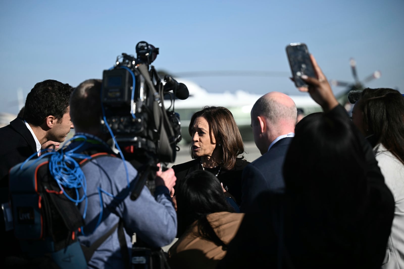 Democratic presidential nominee Vice President Kamala Harris talks to reporters before boarding Air Force Two, Wednesday, Oct. 30, 2024, at Joint Base Andrews, Md. (Brendan Smialowski/Pool via AP)