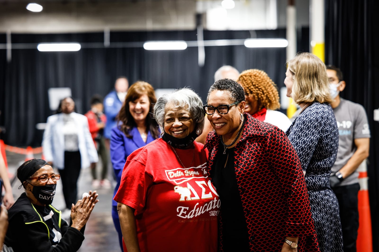 HUD Secretary Marcia Fudge (right) poses for a picture with her cousin Elaine Springer, from Dayton. JIM NOELKER/STAFF