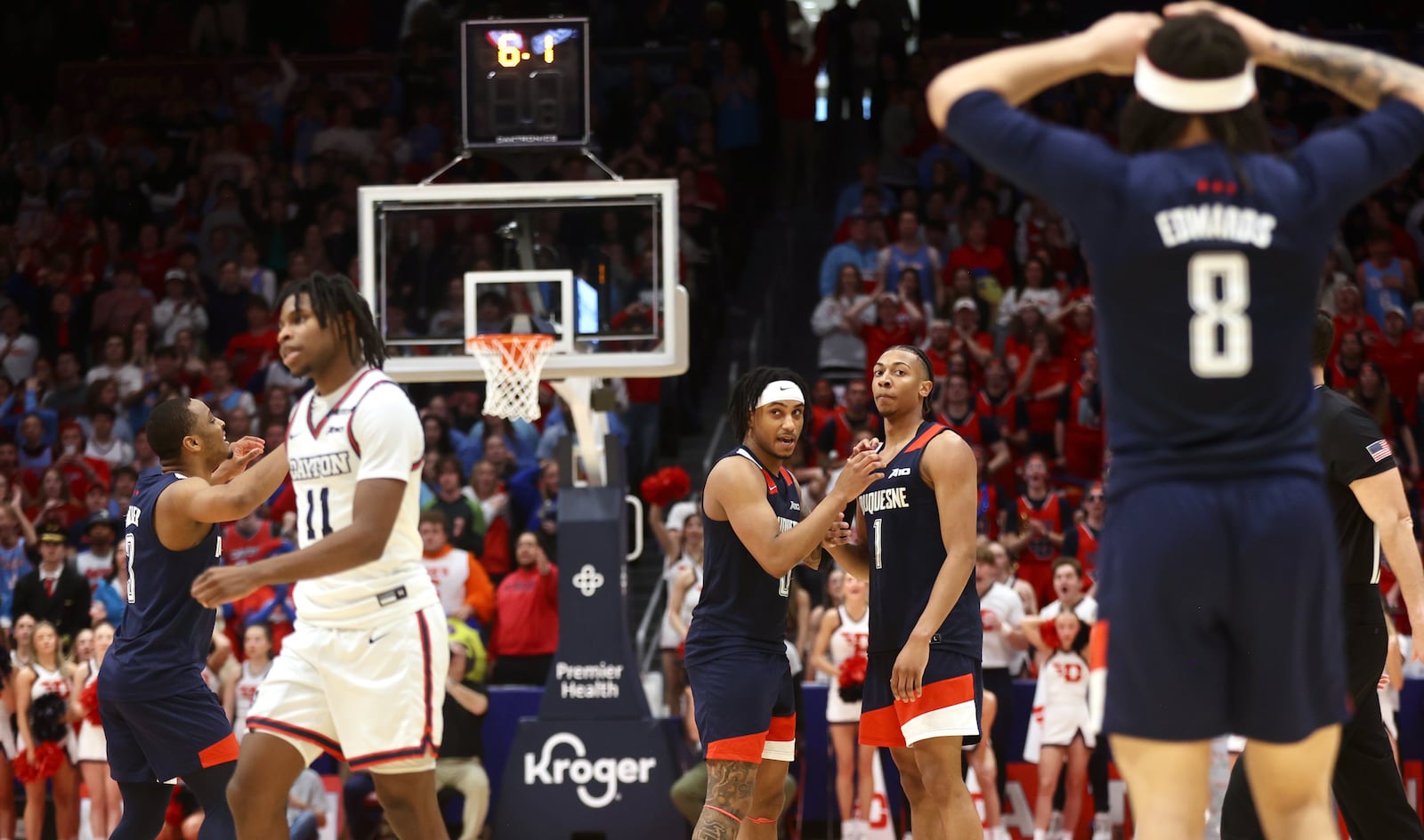 Duquesne players react after Cam Crawford (1) fouled Dayton's Malachi Smith with six seconds to play in a tie game on Saturday, Feb. 15, 2025, at UD Arena.. David Jablonski/Staff