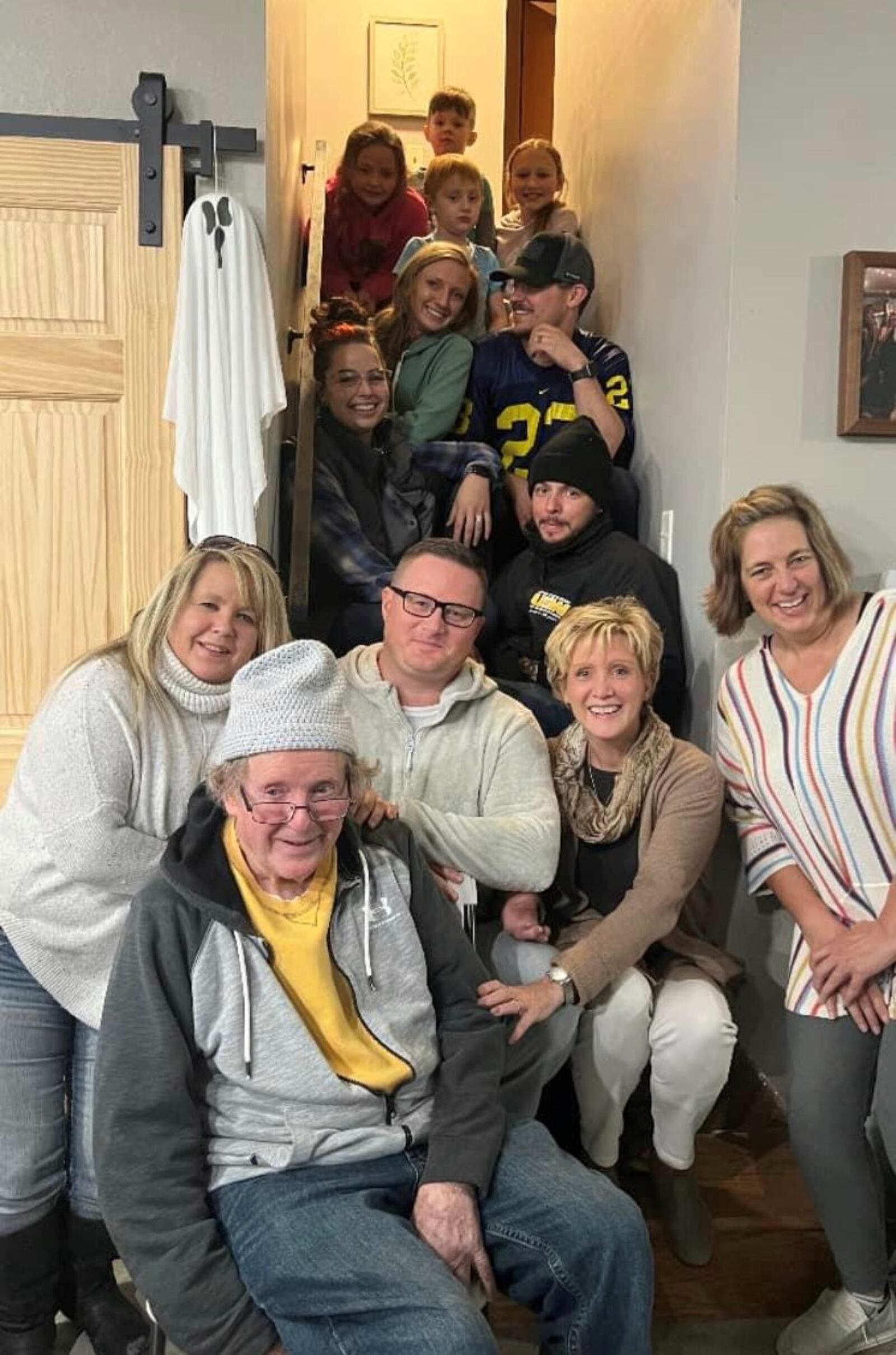 Jane Koester (2nd row, 2nd from right) with her new family, including her dad, Dan Tucker (in front) and her half sister Tammy Pitzen (second row on left). CONTRIBUTED